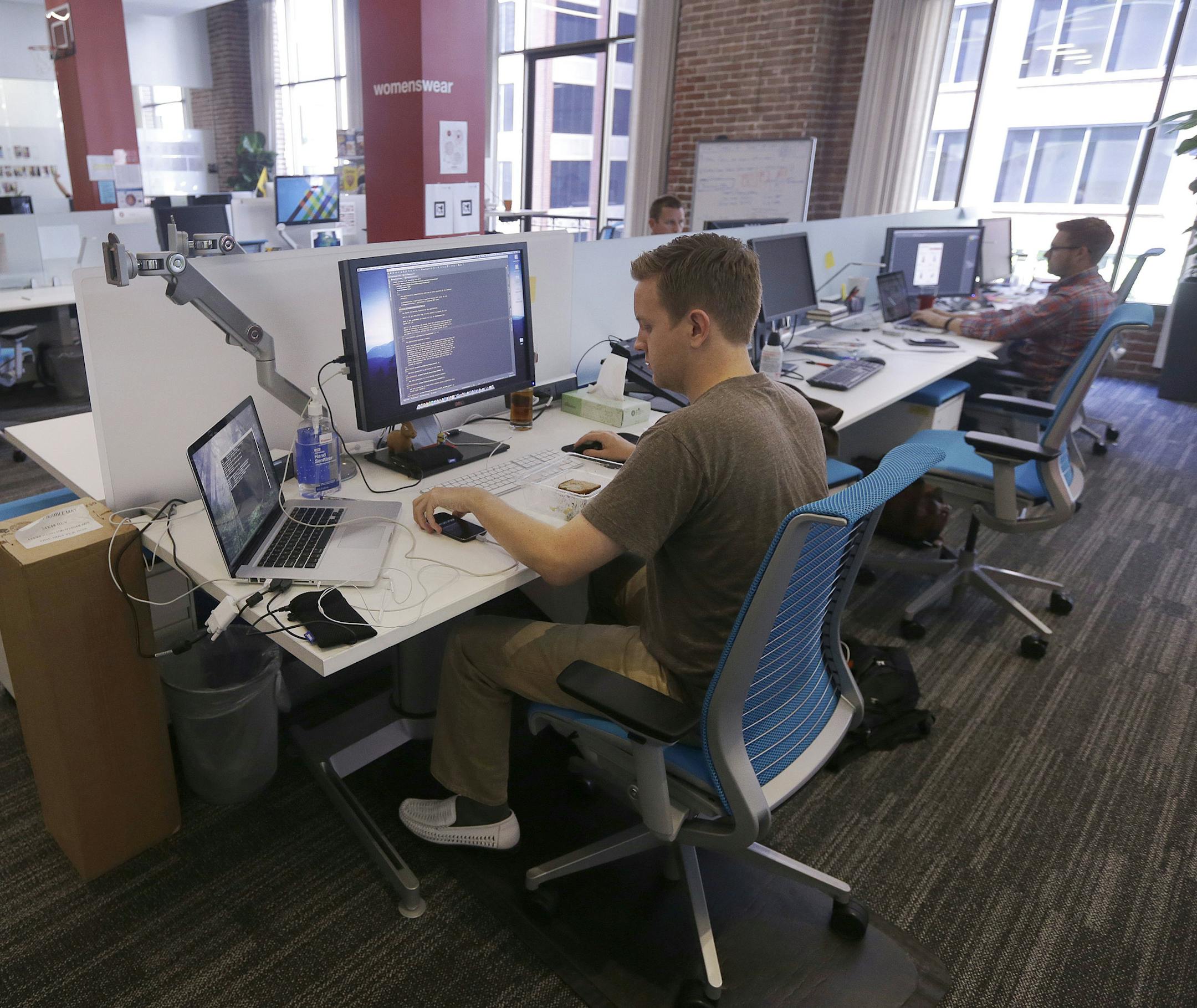 FILE- This Sept. 19, 2013, file photo shows workers at the Target Technology Innovation Center office in San Francisco. According to Fidelity Investments data, millennial long-term participants in a 401(k) now have an average balance of over $100,000. The secret to their success isnít high salaries or rich parents. Itís consistency. (AP Photo/Jeff Chiu, File)