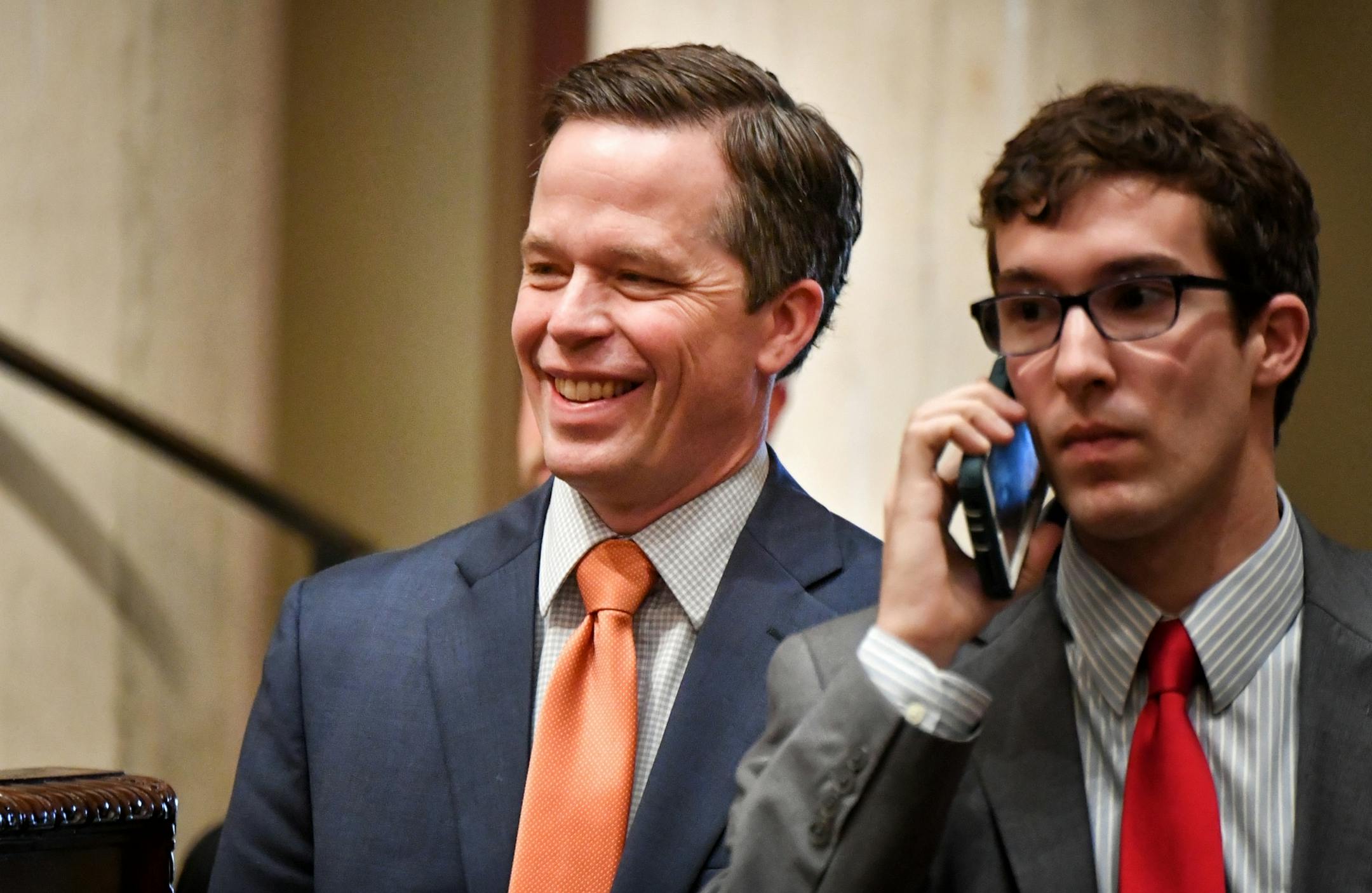 Ben Golnik, Executive Director, Majority Caucus, talked with members on the House floor. On the right is GOP staffer Andrew Hasek.