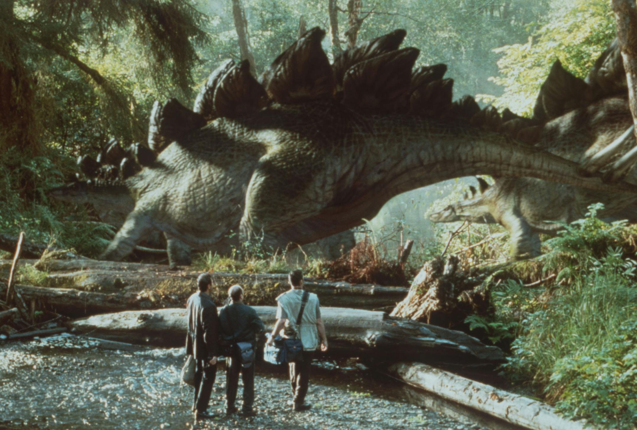 "The Lost World: Jurassic Park" 1997 motion picture, photograph provided by Industrial Light + Magic. Jeff Goldblum, Richard Schiff and Vince Vaughn come dangerously close to a herd of Stegosaurs.