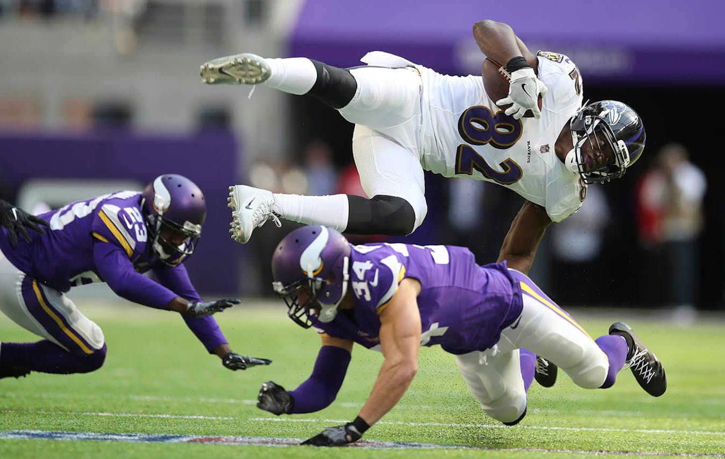 Ravens tight end Benjamin Watson was upended by Vikings strong safety Andrew Sendejo in the second quarter Sunday.