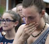 Residents gather to say a prayer near the baseball field, the scene of a multiple shooting in Alexandria, Va., Wednesday, June 14, 2017. A rifle-wield