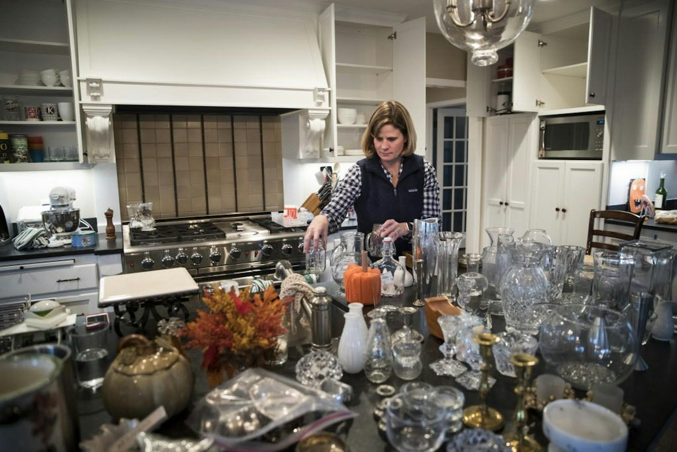 Kershner surveyed her collection of vases to determine which ones she wanted to keep.
