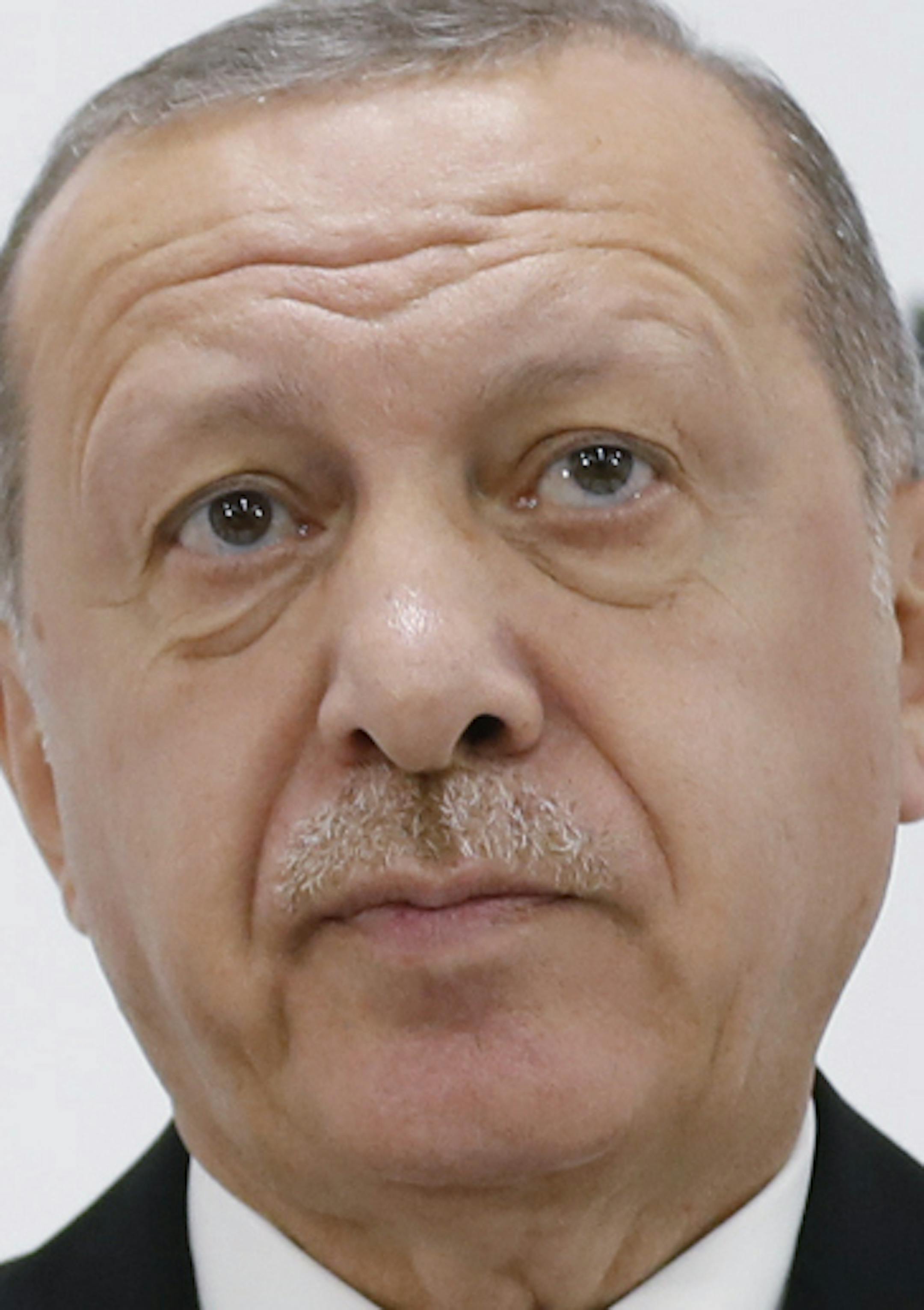 Turkey's President Recep Tayyip Erdogan talks to members of the media during a news conference following the G-20 summit in Osaka, Japan, Saturday, June 29, 2019. Erdogan said he expects the scheduled delivery of the Russian S-400 air defense missiles under a contract that has vexed the United States. The U.S. has strongly urged NATO member Turkey to pull back from the deal, but Ankara has refused to budge and the first shipments are expected next month. (Presidential Press Service via AP, Pool)