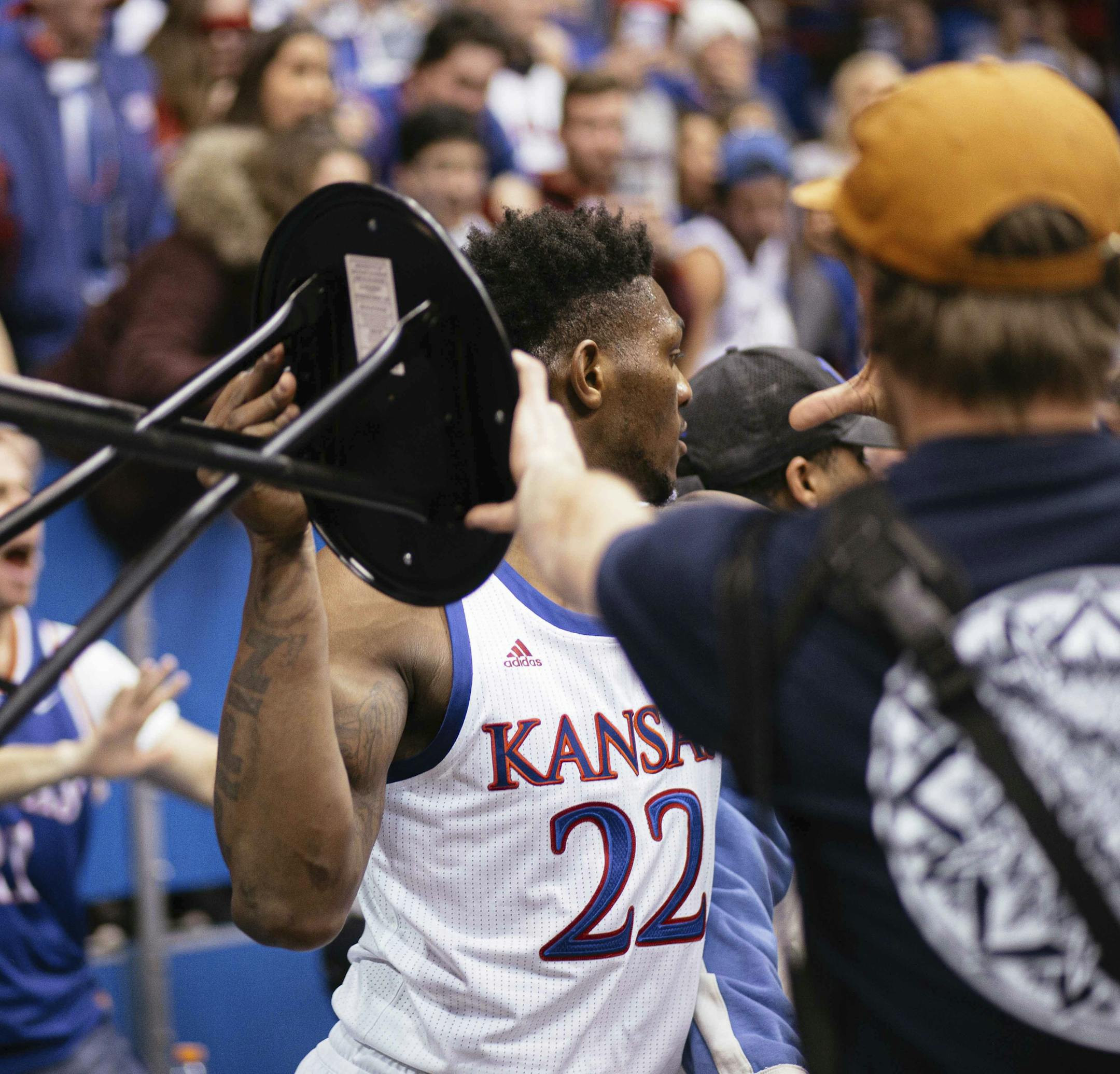 Kansas forward Silvio De Sousa (22) takes part in a brawl in the second half of an NCAA college basketball game against Kansas State, Tuesday, Jan. 21, 2020 in Lawrence, Kan. No. 3 Kansas has suspended De Sousa indefinitely for his role in a brawl near the end of their game. (Emma Pravecek/University Daily Kansan via AP)