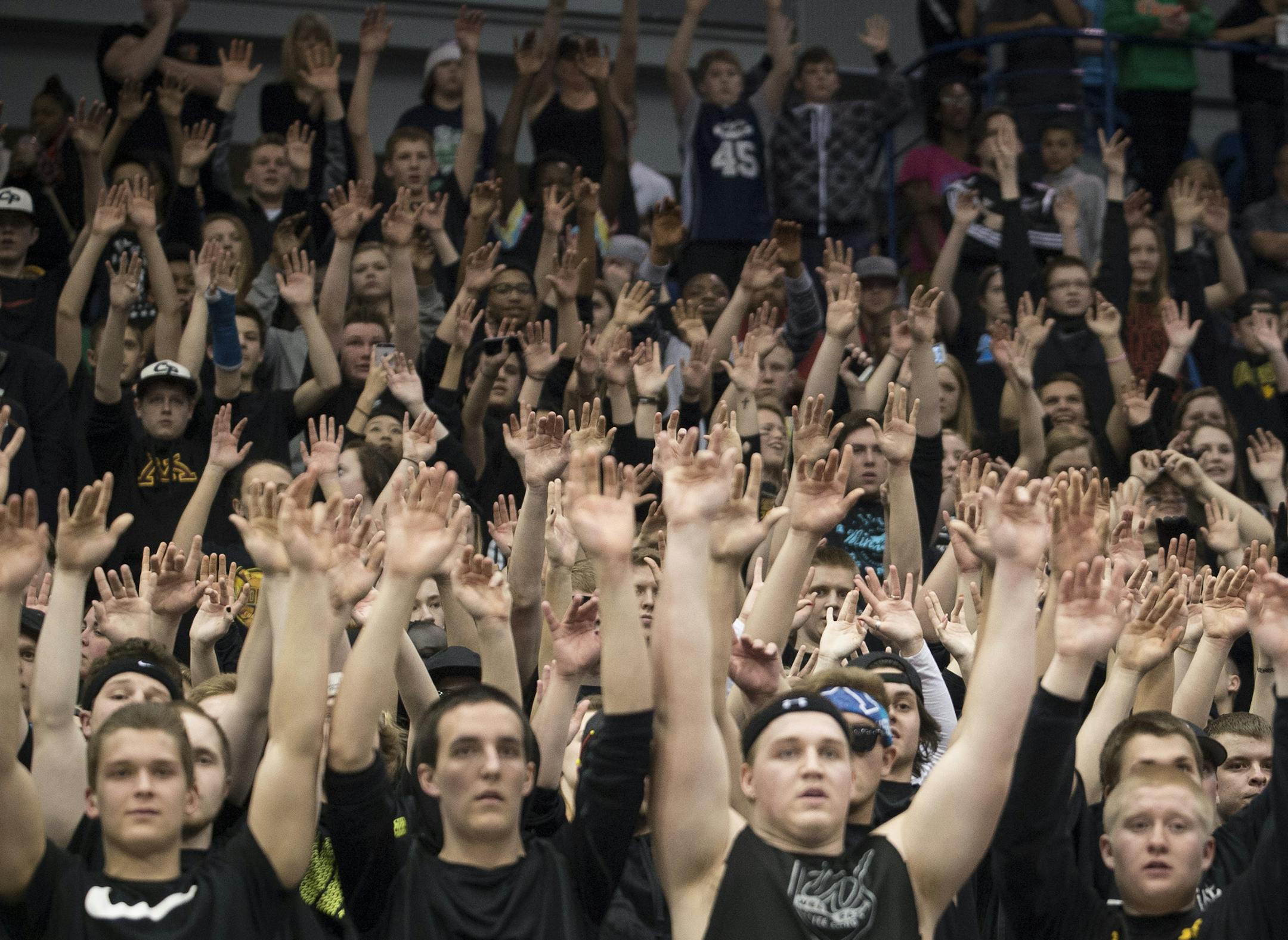 The Champlin Park student section cheers on the team during free throws in the final minute of Thursday night's semifinal game against Shapokee. ] (Aaron Lavinsky | StarTribune) Shakopee plays Champlin Park in the boys' basketball Class 4A semifinals on Thursday, March 12, 2015 at Target Center. Champlin Park beat Shapokee 65-57.