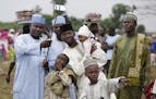 A Nigeria Muslim family takes a selfie portrait before Eid al-Fitr prayer, marking the end of the Muslim holy fasting month of Ramadan in Lagos, Niger