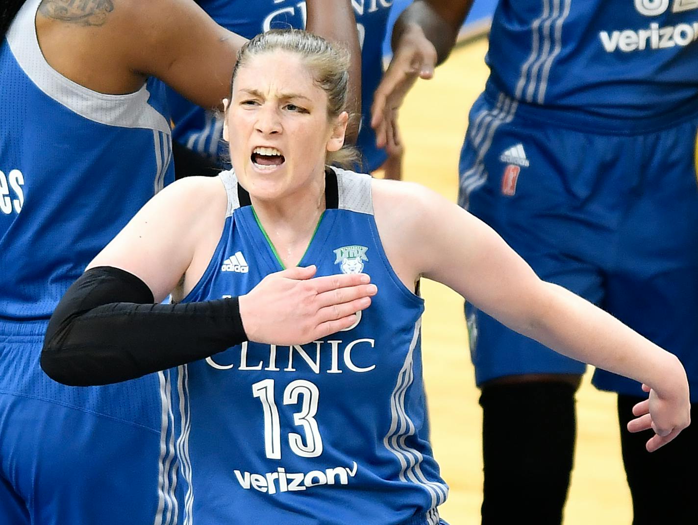 Minnesota Lynx guard Lindsay Whalen (13) pounded her chest in celebration after drawing a shooting foul in the first quarter against the Los Angeles Sparks.