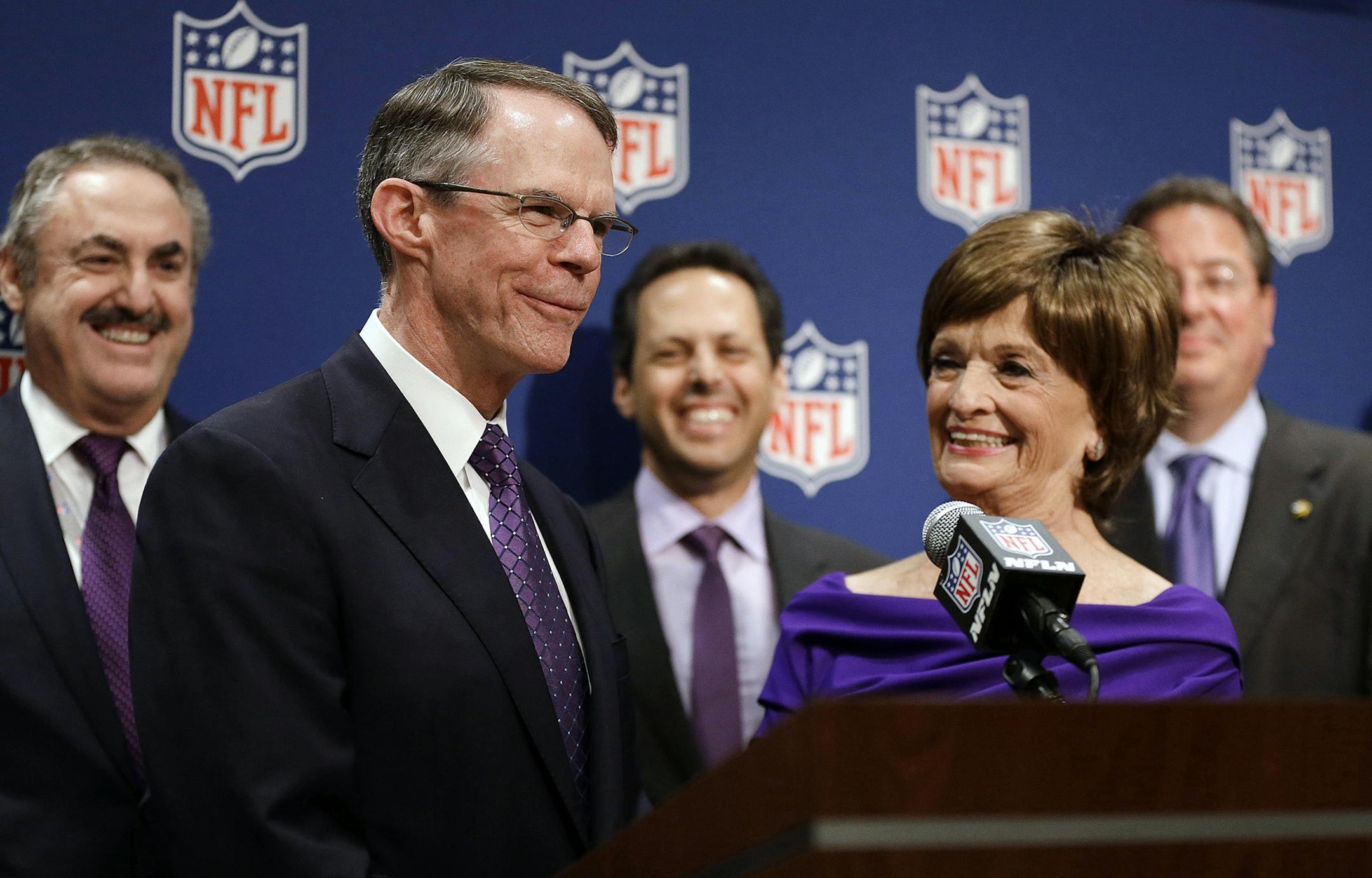 Minneapolis bid committee co-chairs Richard Davis, left, CEO of U.S. Bancorp, and Marilyn Carlson Nelson, right, speak at a news conference after Minneapolis was selected as the host for 2018 Super Bowl at the NFL's spring meetings, Tuesday, May 20, 2014, in Atlanta. Minneapolis will host the 2018 Super Bowl after a vote by owners on Tuesday rewarded the city for getting a new stadium deal. The owners chose Minneapolis and the new $1 billion stadium planned for the site of the old Metrodome to h