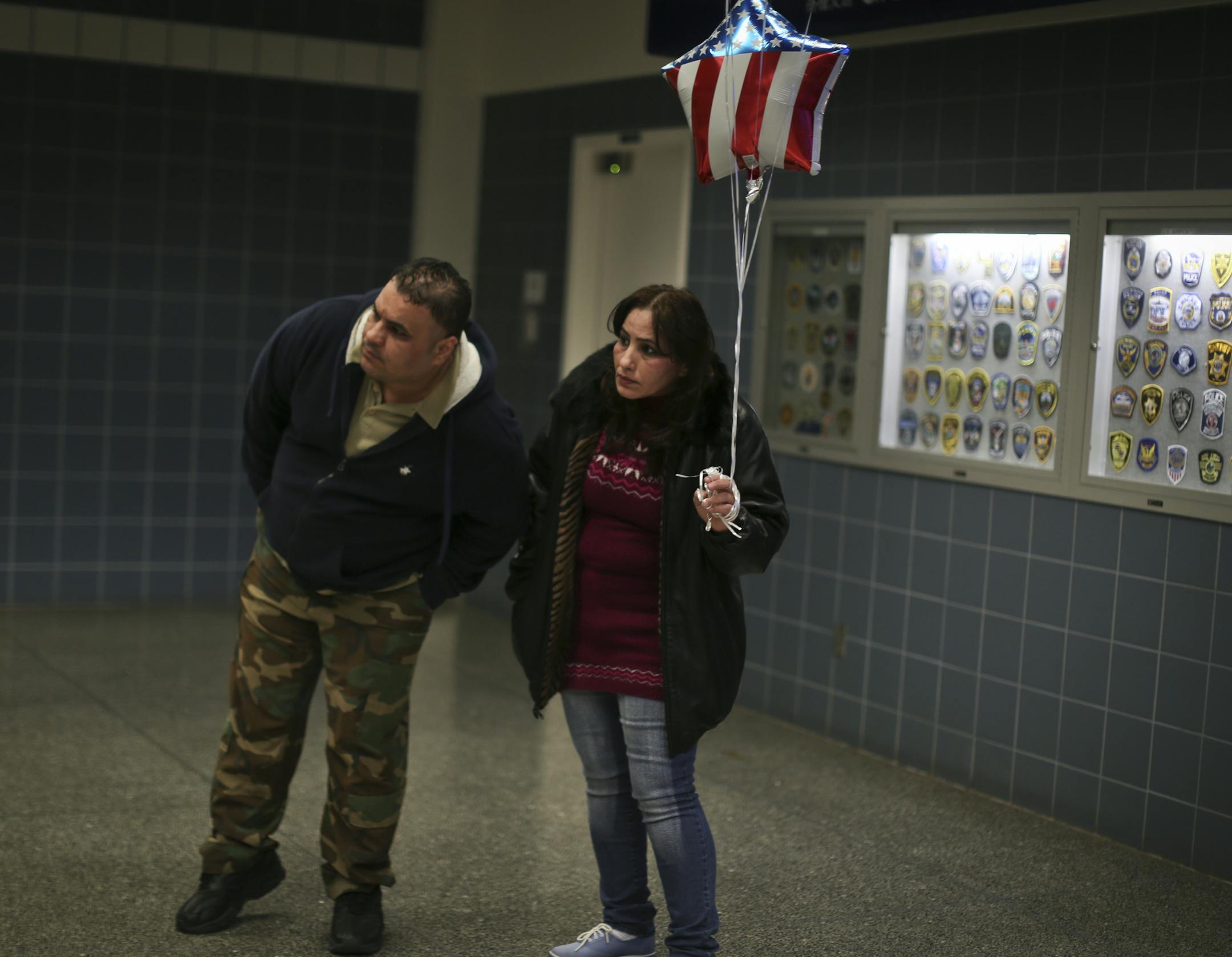 In this picture; Mishaal Alkadi and his sister Ohood Alqadhi waited anxiously for the arrival of Amer, Mishaal's son. Iraqi refugee Mishaal Alkadi was reunited with the two-year-old son, Amer, at the Minneapolis/St. Paul International airport on Wednesday, April 24, 2013. His wife and the boy's mother was killed by terrorists as she and the boy waited to leave and rejoin Alkadi in the US. ] (RENEE JONES SCHNEIDER * reneejones@startribune.com)