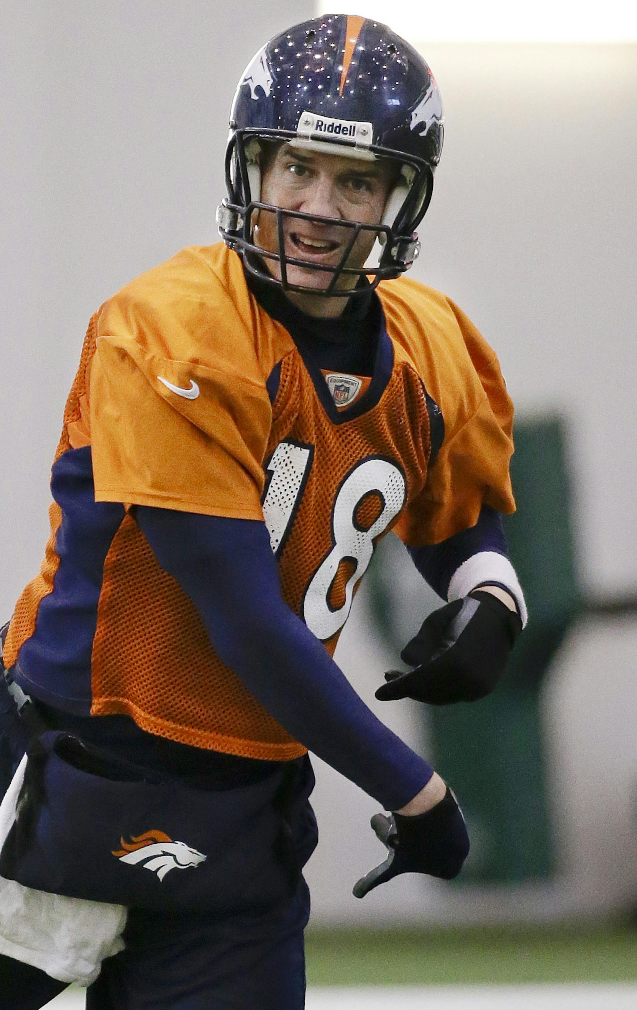 Denver Broncos quarterback Peyton Manning passes during practice Thursday, Jan. 30, 2014, in Florham Park, N.J. The Broncos are scheduled to play the Seattle Seahawks in the NFL Super Bowl XLVIII football game Sunday, Feb. 2, in East Rutherford, N.J. (AP Photo)