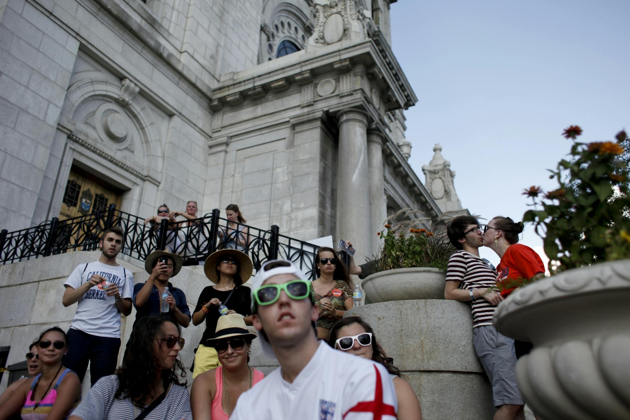 A couple steals kiss during the performance of Tyrone Wells at the 18th annual Cities 97 Basilica Block Party in Minneapolis, Minn. on Friday July 6, 2012.