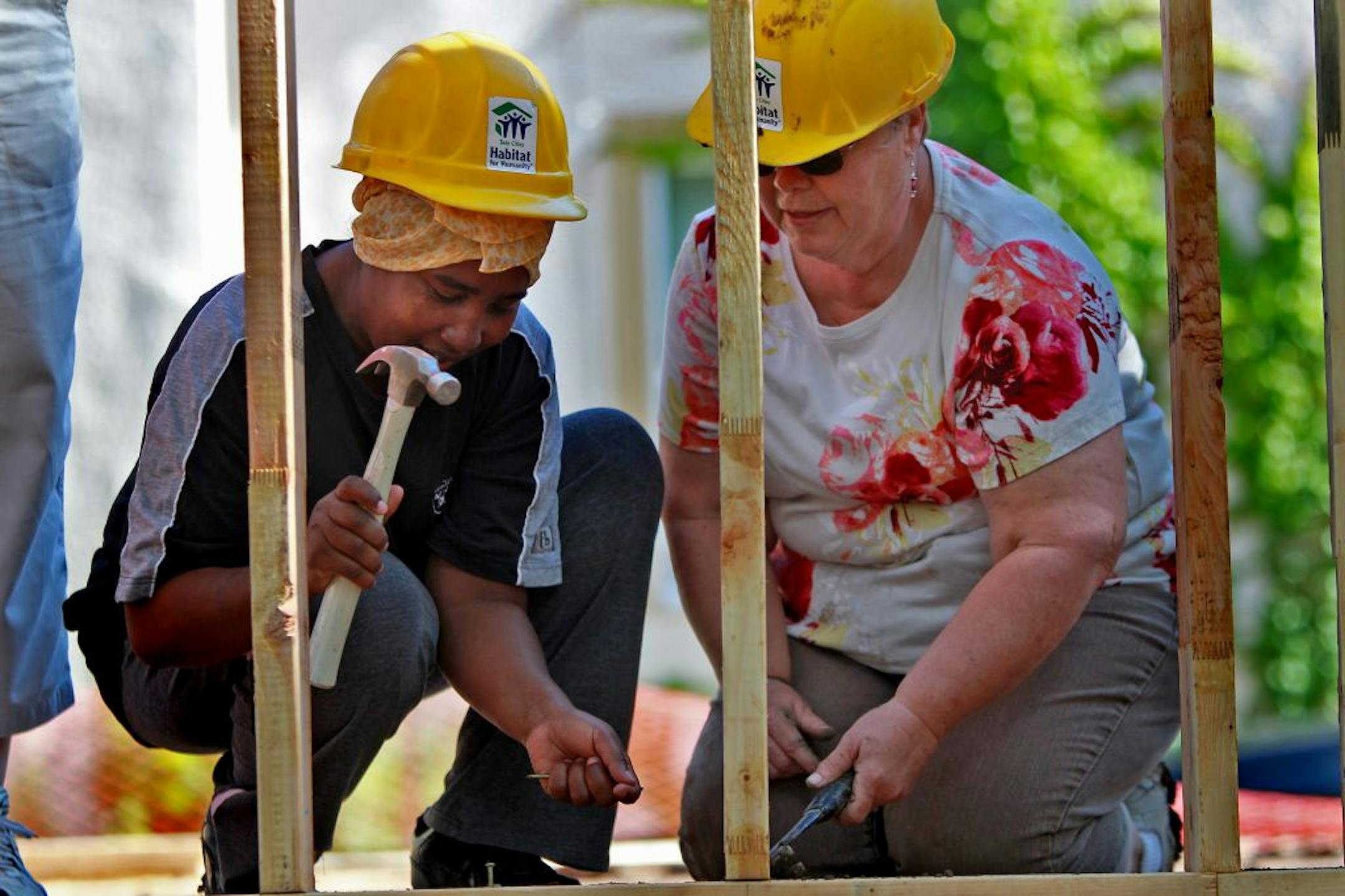 Muna Haji, left, and District 58 Senator Linda Higgins joined other volunteers from Habitat for Humanity and Women Build, construct a home for Haji on Minneapolis' north side Monday, June 11, 2012. (ELIZABETH FLORES/STAR TRIBUNE) ELIZABETH FLORES � eflores@startribune.com