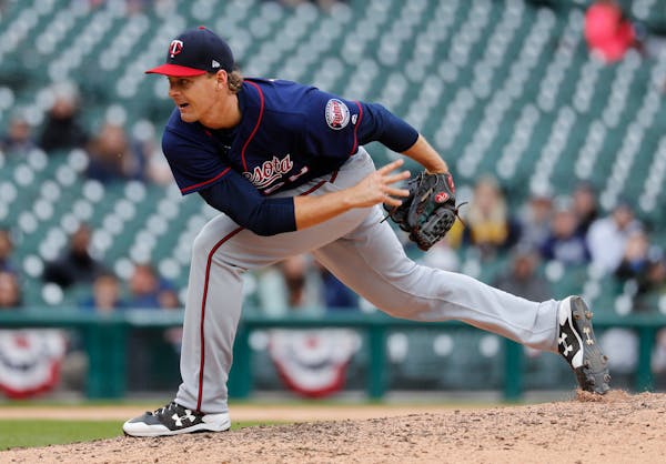 Minnesota Twins relief pitcher Justin Haley throws against the Detroit Tigers in the ninth inning of a baseball game in Detroit, Thursday, April 13, 2