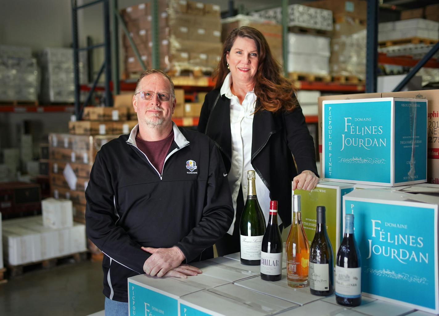 Bourget Imports partners Terry Merek and Annette Peters in their Eagan warehouse. Peters worked hard to get an early application in for the federal government's new paycheck protection plan that is part of the COVID-19 relief package passed by Congress. The program has been beset with misunderstanding and delays. ] brian.peterson@startribune.com
Eagan, MN Thursday, April 16, 2020