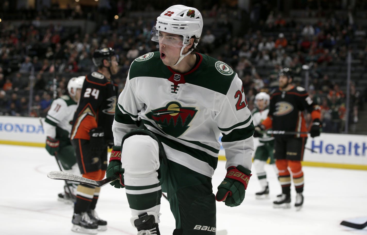 Minnesota Wild left wing Kevin Fiala, center, of Switzerland, reacts after scoring against the Anaheim Ducks during the first period of an NHL hockey game in Anaheim, Calif., Sunday, March 8, 2020. (AP Photo/Alex Gallardo)