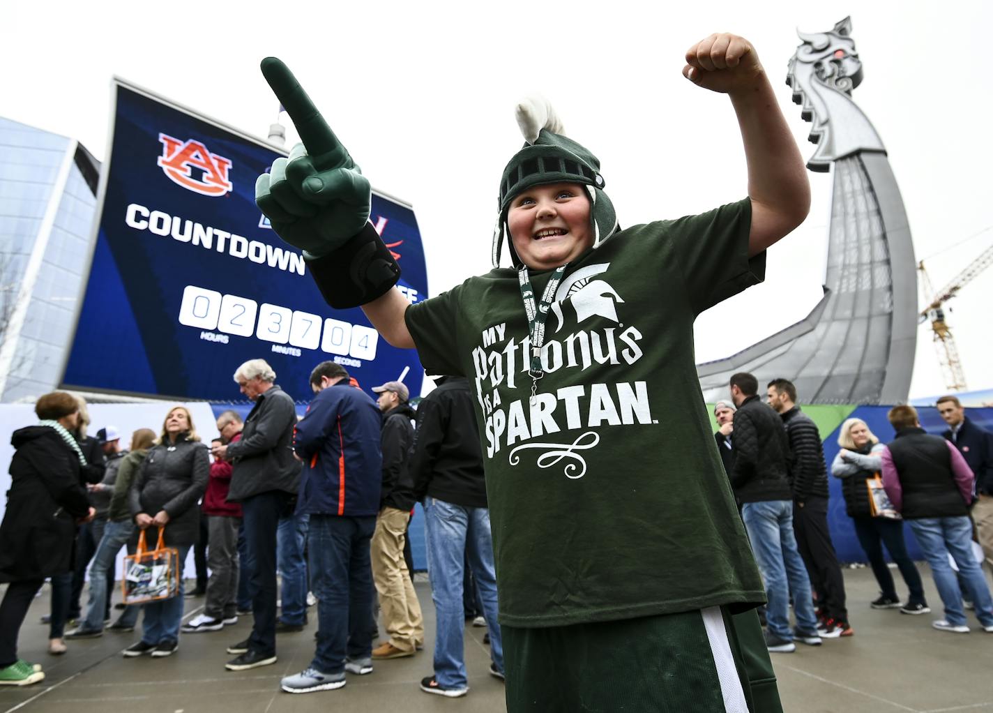 Tristan Dieterle, 10, from Michigan's Upper Peninsula, showed his excitement with meeting Michigan State's Sparty as he waited with his aunt, cousin and grandmother for the gates to open before the Final Four Saturday. ] Aaron Lavinsky &#xa5; aaron.lavinsky@startribune.com Fans lined up outside US Bank Stadium for the Final Four on Saturday, April 6, 2019 in Minneapolis, Minn.