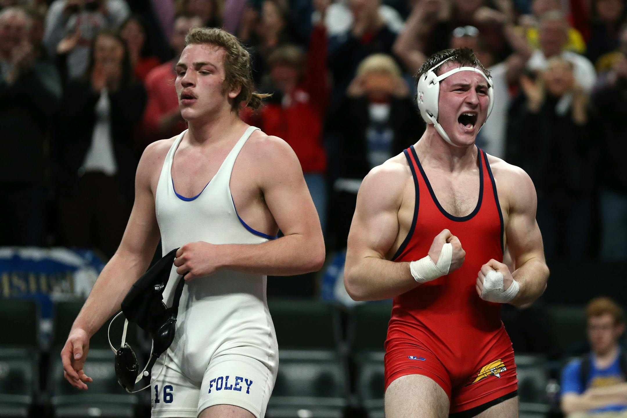 Orono's Bobby Striggow, right, celebrated after defeating Foley's Saylor Schmit
