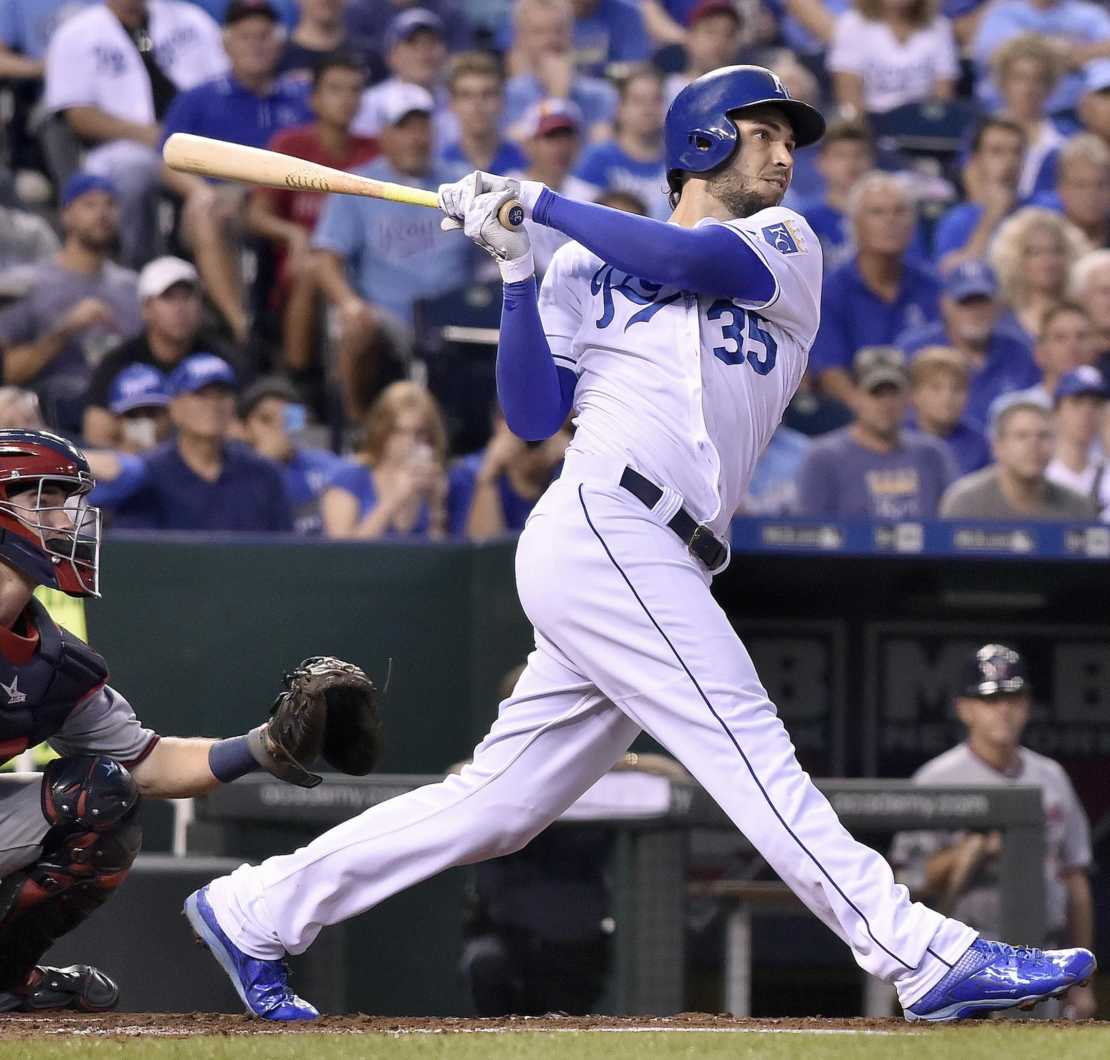The Kansas City Royals' Eric Hosmer (35) follows through on a three-run double in the first inning in front of Minnesota Twins catcher Chris Herrmann on Tuesday, Sept. 8, 2015, at Kauffman Stadium in Kansas City, Mo. (John Sleezer/Kansas City Star/TNS)