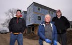 Gary Findell, center, with Dana Taylor, left, and Jim Erchul in St. Paul. NeuHus founder Findell plans to launch a modular-housing factory in the Midw