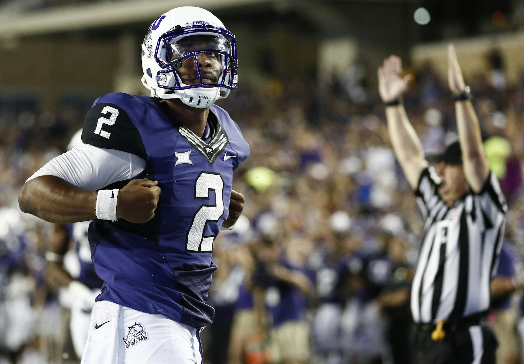 TCU quarterback Trevone Boykin reacts after his touchdown run against Samford in the second half of an NCAA college football game in Fort Worth, Texas, Saturday, Aug. 30, 2014. TCU won 48-14. (AP Photo/Jim Cowsert)