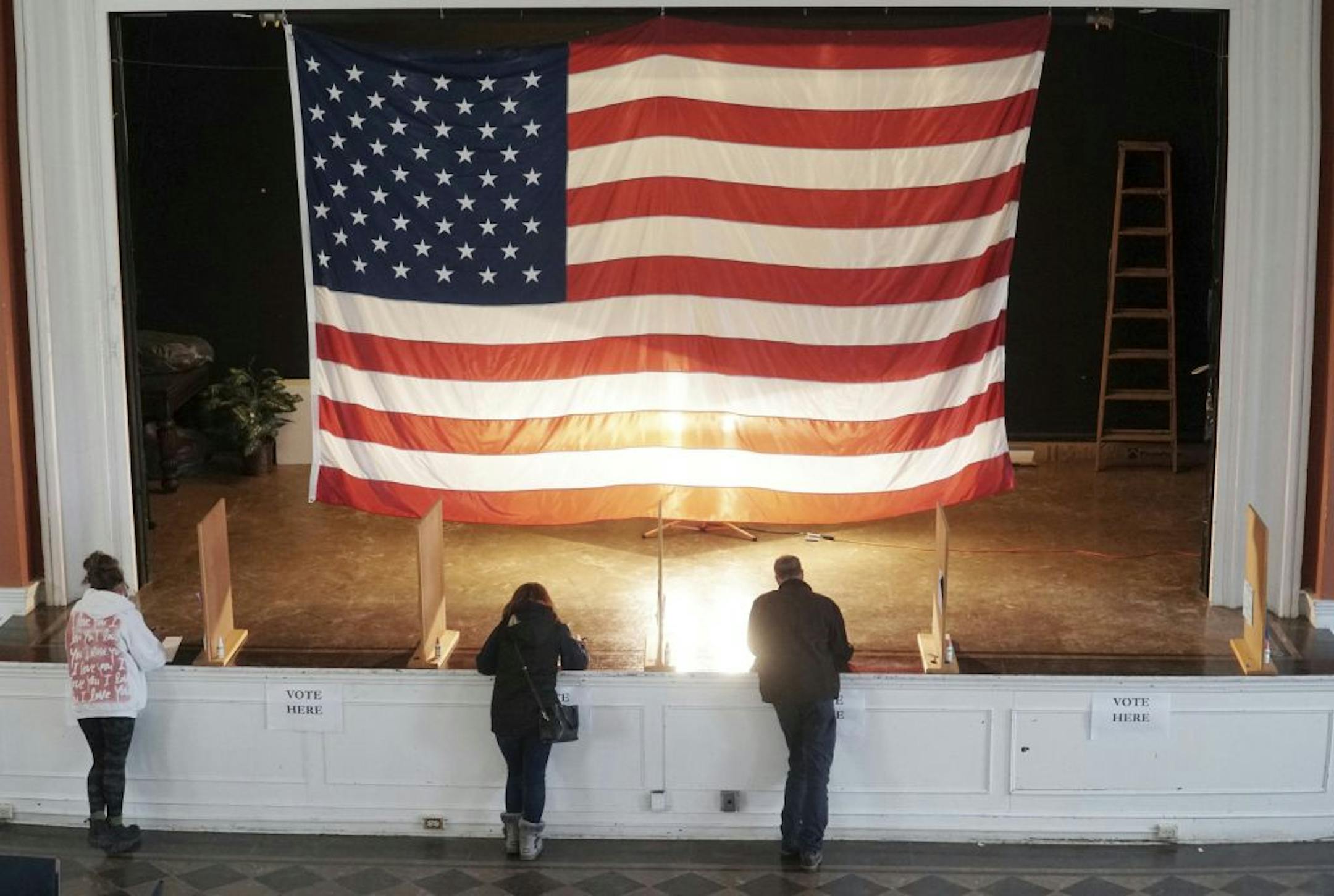 Voters fill out their ballots at the Lenox, Mass., Town Hall on Election Day, Tuesday, November 3, 2020. According to poll workers, turnout is high this year with early voting.