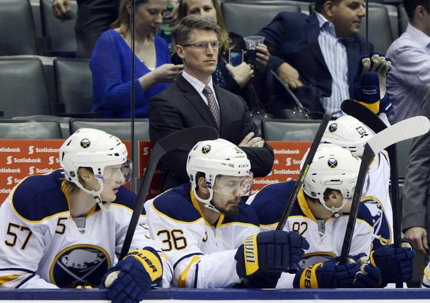 Buffalo Sabres interim head coach Ron Rolston stands behinds his players during an NHL hockey game against the Toronto Maple Leafs in Toronto, Thursday, Feb. 21, 2013. The Sabres fired head coach Lindy Ruff on Wednesday.