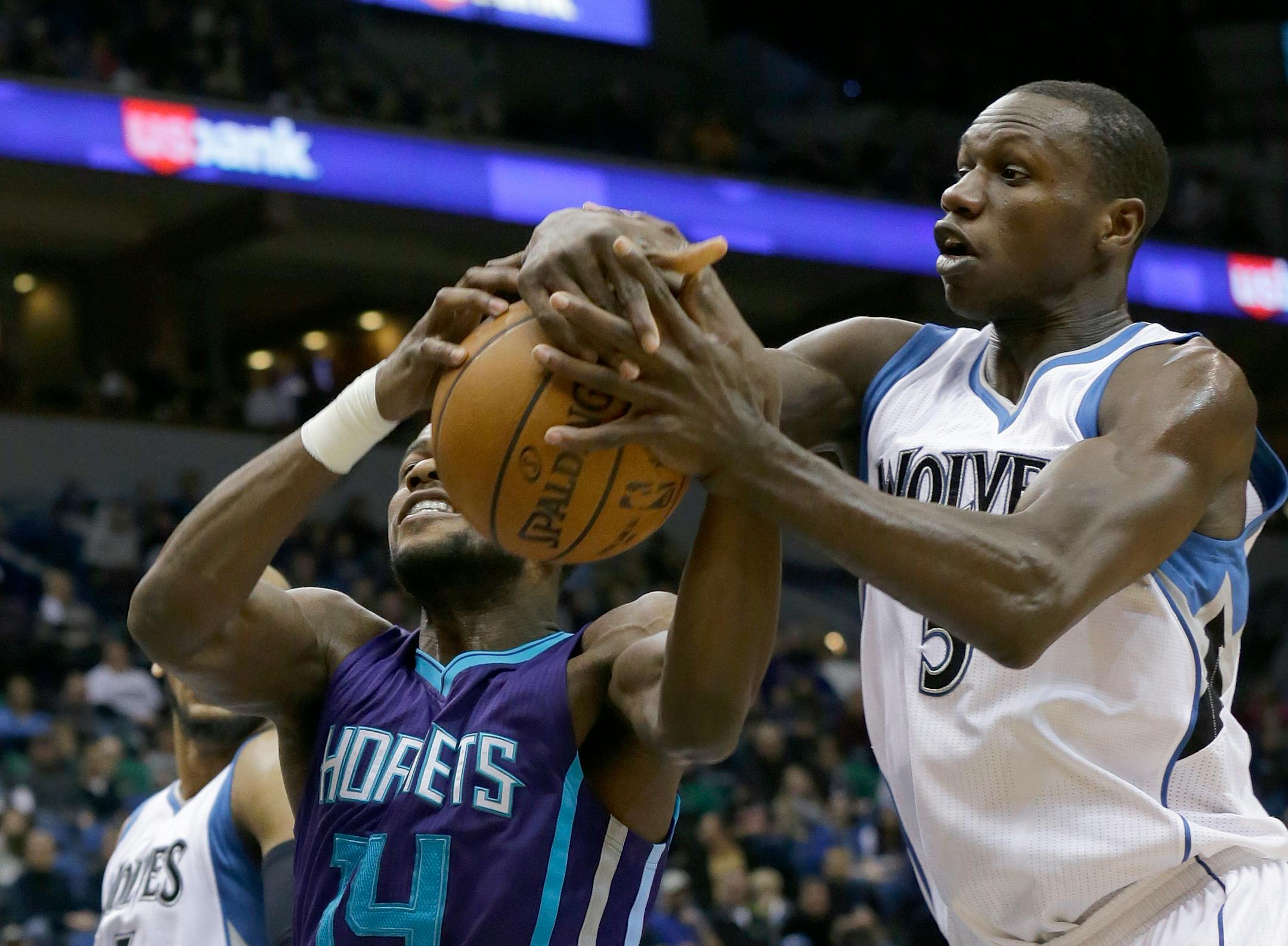 Charlotte forward Michael Kidd-Gilchrist, left, and Timberwolves center Gorgui Dieng battled for a rebound.