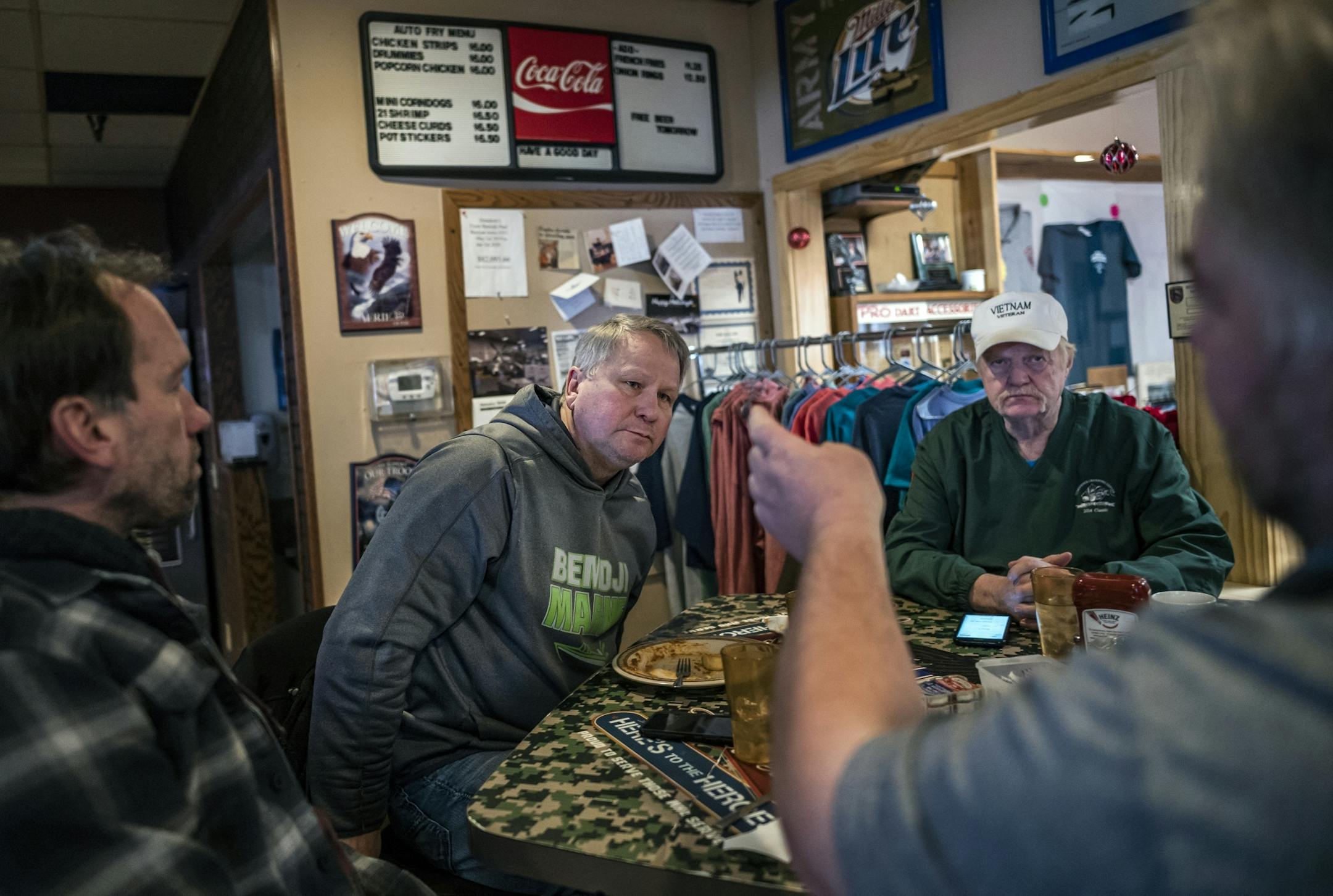 "Show me where the money is," says Davey Mills(grey sweatshirt) who along with Bemidji Eagles Aerie #351 manager Dick Jacobson do not think Beltrami County can welcome refugees because of its own problems with poverty and homelessness.