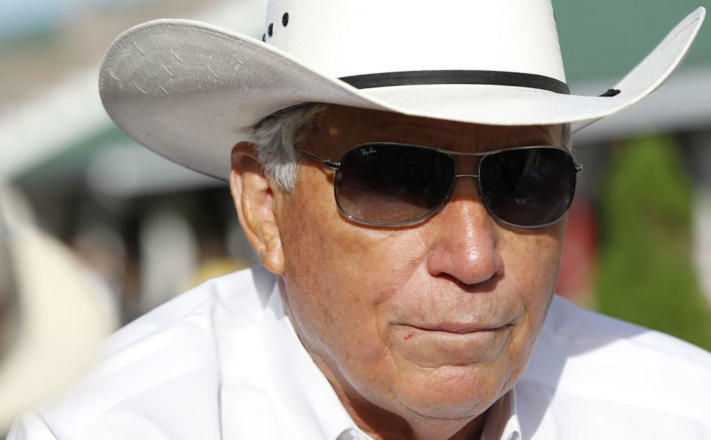 Trainer D. Wayne Lukas looks over the track following workouts on Thursday May 2, 2013, at Churchill Downs in Louisville, Kentucky, in preparation for the Kentucky Derby.