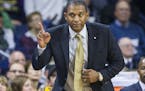 Milwaukee head coach Rob Jeter waves a finger as he questions a call during the second half of an NCAA college basketball game against Notre Dame, Tue