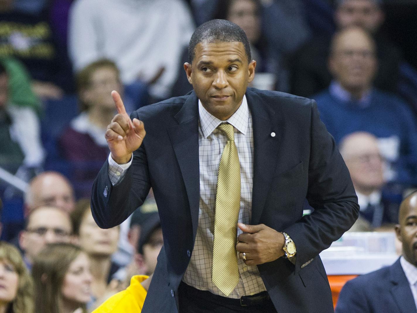 Milwaukee head coach Rob Jeter waves a finger as he questions a call during the second half of an NCAA college basketball game against Notre Dame, Tuesday, Nov. 17, 2015, in South Bend, Ind. (AP Photo/Robert Franklin)