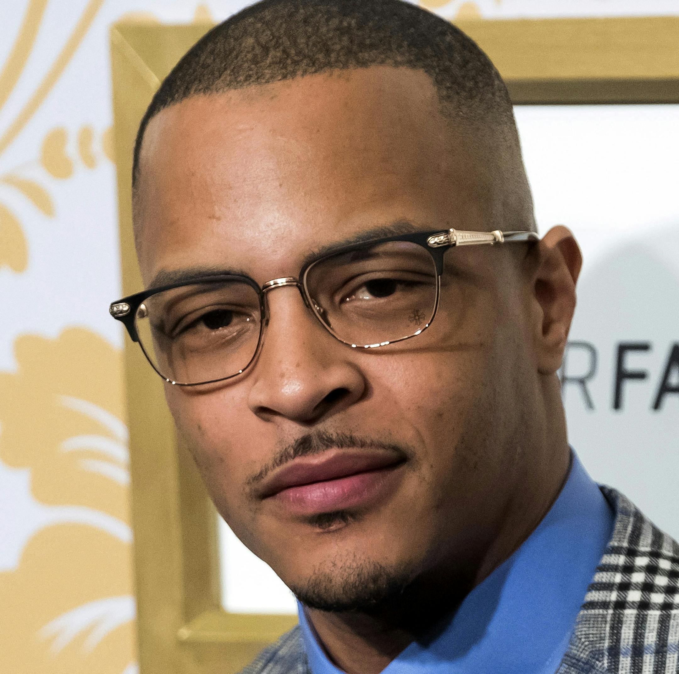 FILE - In this Jan. 27, 2018 file photo, T.I. attends the Roc Nation pre-Grammy brunch in New York. Police say rapper T.I. has been arrested for disorderly conduct and public drunkenness as he tried to enter his gated community outside Atlanta. Henry County Police Deputy Mike Ireland said T.I. was arrested around 4:30 a.m. Wednesday, May 16, after he got into an argument with a security guard. Media reports say the rapper, whose real name is Clifford Harris, lost his key and the guard wouldn't l