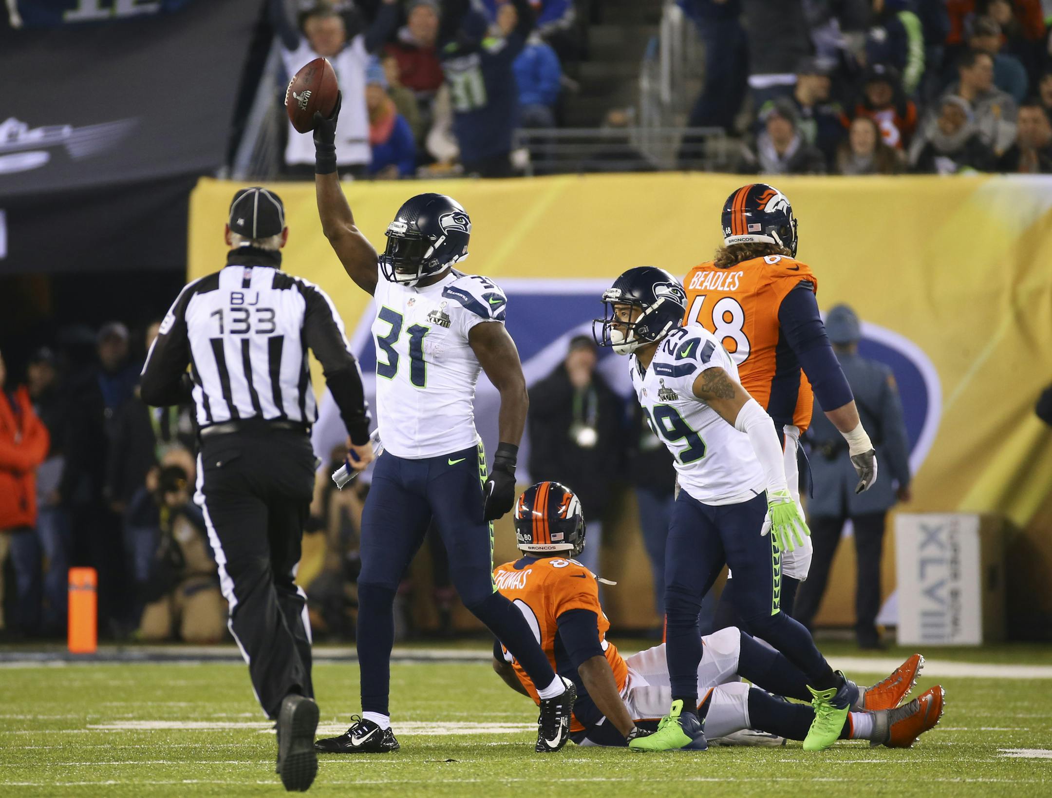 Seattle Seahawks strong safety Kam Chancellor (31) intercepts a pass from Denver Broncos quarterback Peyton Manning in the first half of the NFL Super Bowl XLVIII football game against the Seattle Seahawks at MetLife Stadium in East Rutherford, N.J., Feb. 2, 2014. (Chang W. Lee/The New York Times)