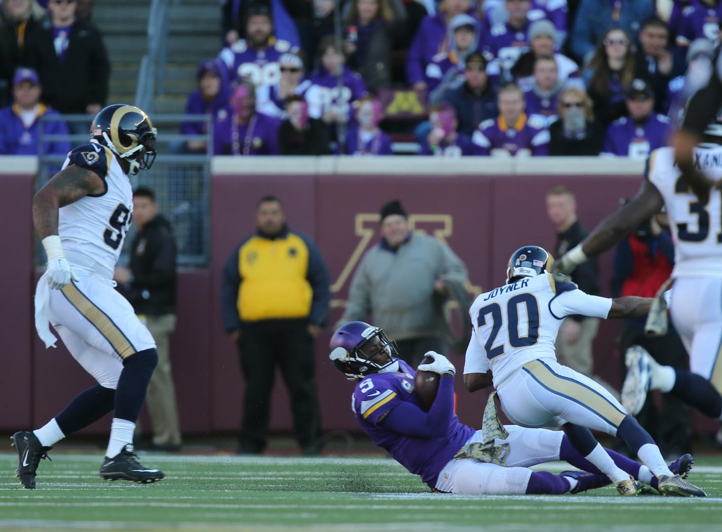 Vikings quarterback Teddy Bridgewater scrambled for a five yard gain before being hit hard by Rams cornerback Lamarcus Joyner (20) as he slid to the ground in the fourth quarter Sunday afternoon. Joyner was penalized for unnecessary roughness on th play. Bridgewater left the game after the hit. ] JEFF WHEELER � jeff.wheeler@startribune.com The Minnesota Vikings beat the St. Louis Rams 21-18 in overtime on a 40 yard Blair Walsh field goal Sunday afternoon, November 8, 2015 at TCF Bank Stadium in