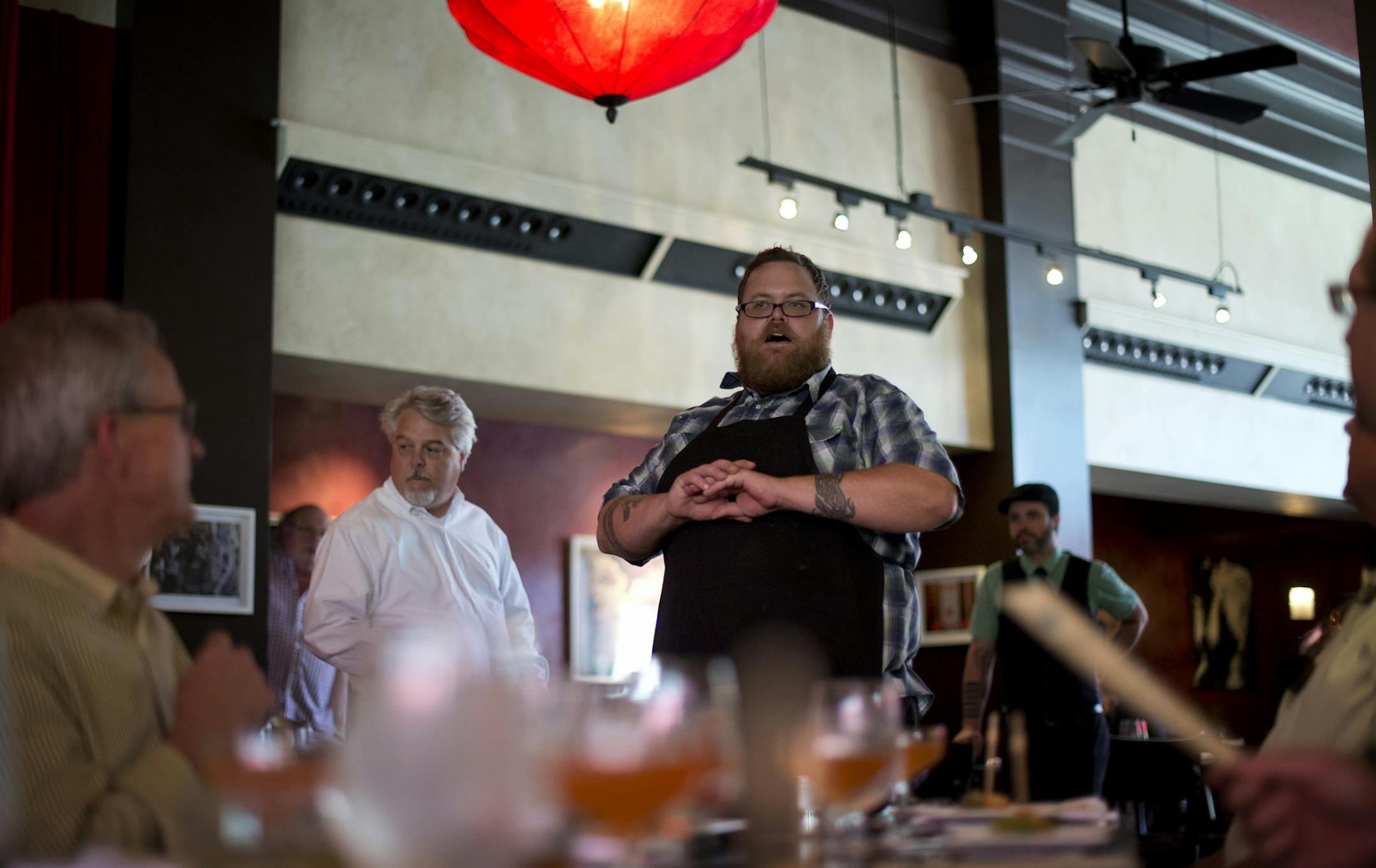 Chef Tommy Begnaud described each course to the 29 diners at Cafe Maude at Loring. The Minnesota Epicurean Society met Wednesday August 7, 2013, at Cafe Maude at Loring for a five-course meal with paired cocktails. For 42 years, a local Epicurean Club has been gathering for a late -- and long -- lunches once a month at restaurants. Never the same one twice. ] GLEN STUBBE * gstubbe@startribune.com