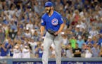 Cubs starter Jake Arrieta reacted in the ninth inning after throwing his first career no-hitter, beating the Dodgers 2-0 on Sunday.