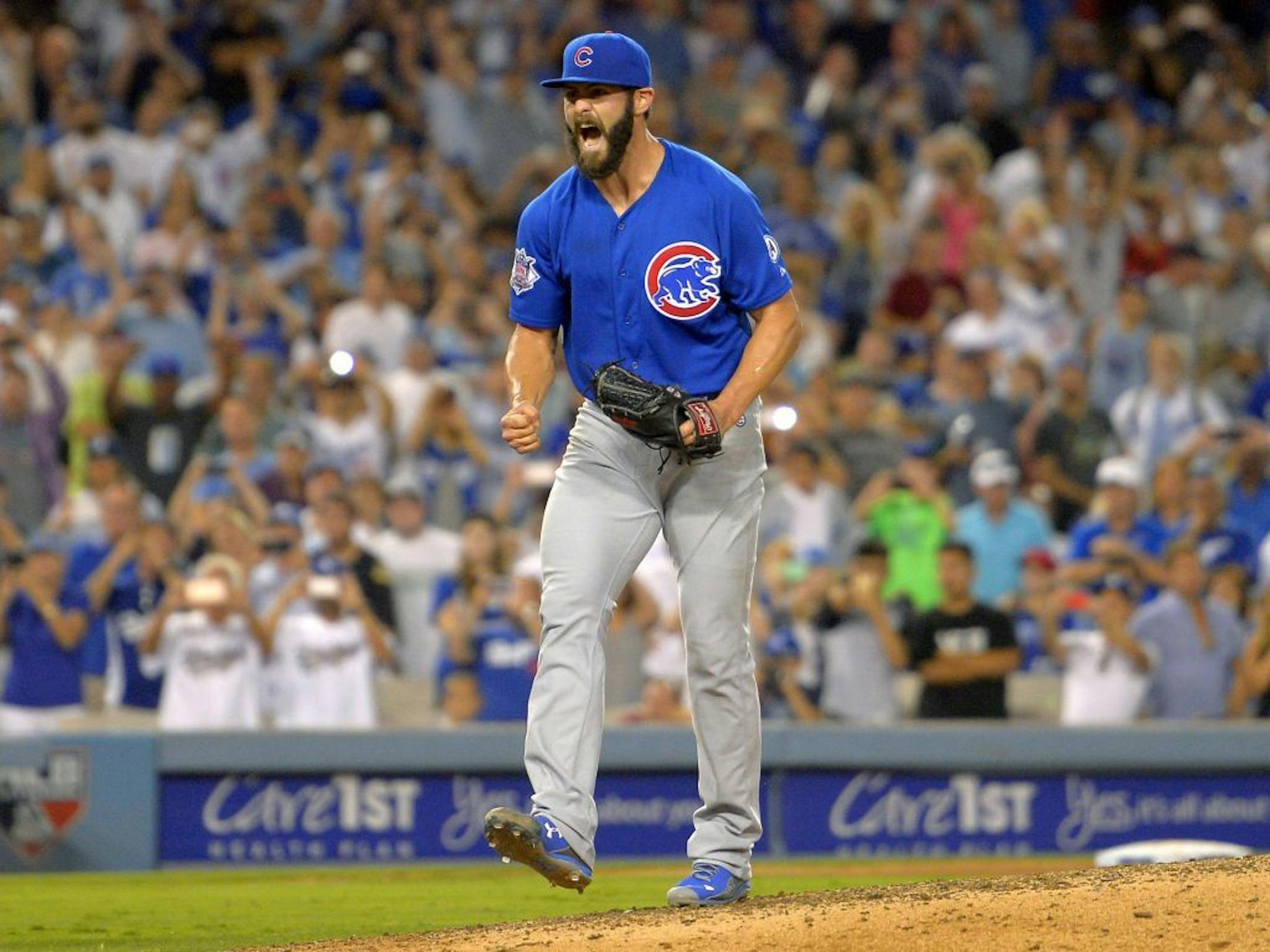 Cubs starter Jake Arrieta reacted in the ninth inning after throwing his first career no-hitter, beating the Dodgers 2-0 on Sunday.