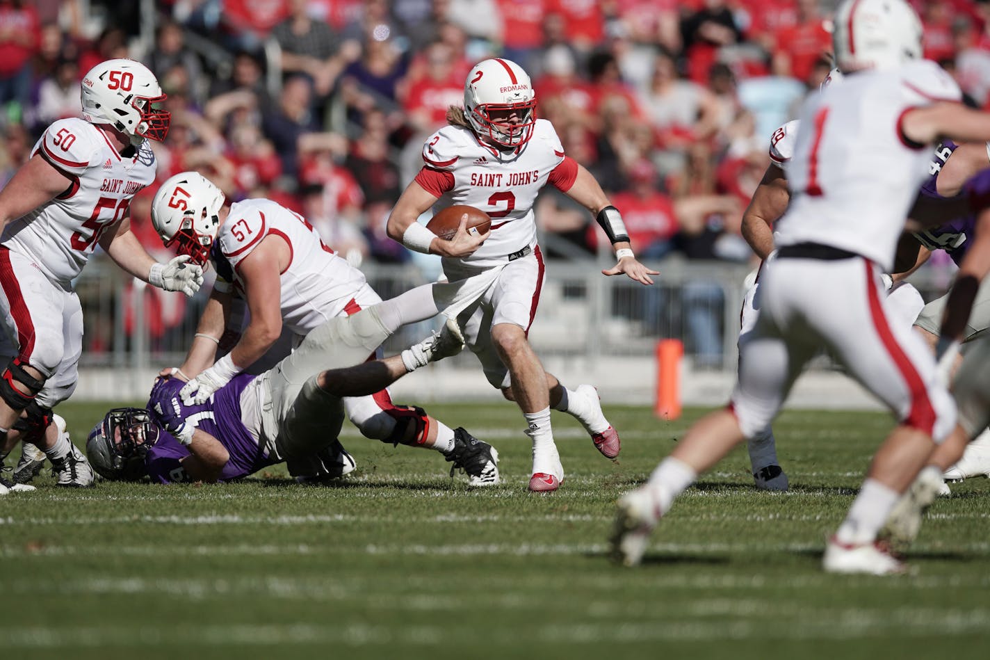 St. John's quarterback Jackson Erdmann (2) drove through St. Thomas' defense in the second quarter. ] MARK VANCLEAVE ¥ St. John's University played the University of St. Thomas on Saturday, Oct. 19, 2019 at Allianz Field in St. Paul. St. John's defeated St. Thomas 38-20.