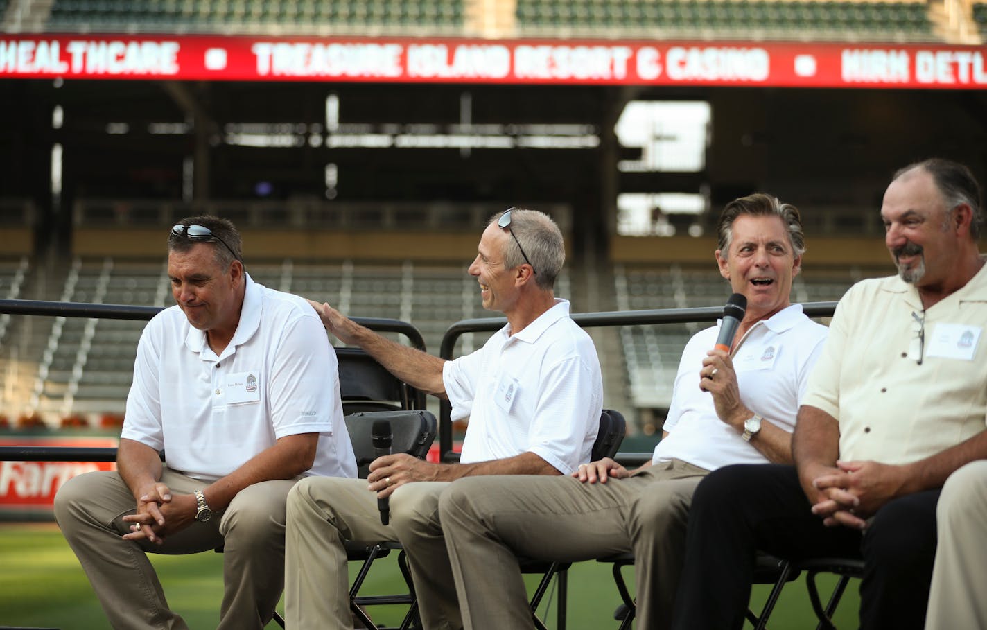 Roy Smalley, second from right, told a yarn about Kent Hrbek, left, who was comforted by Greg Gagne. Gary Gaetti was at right.