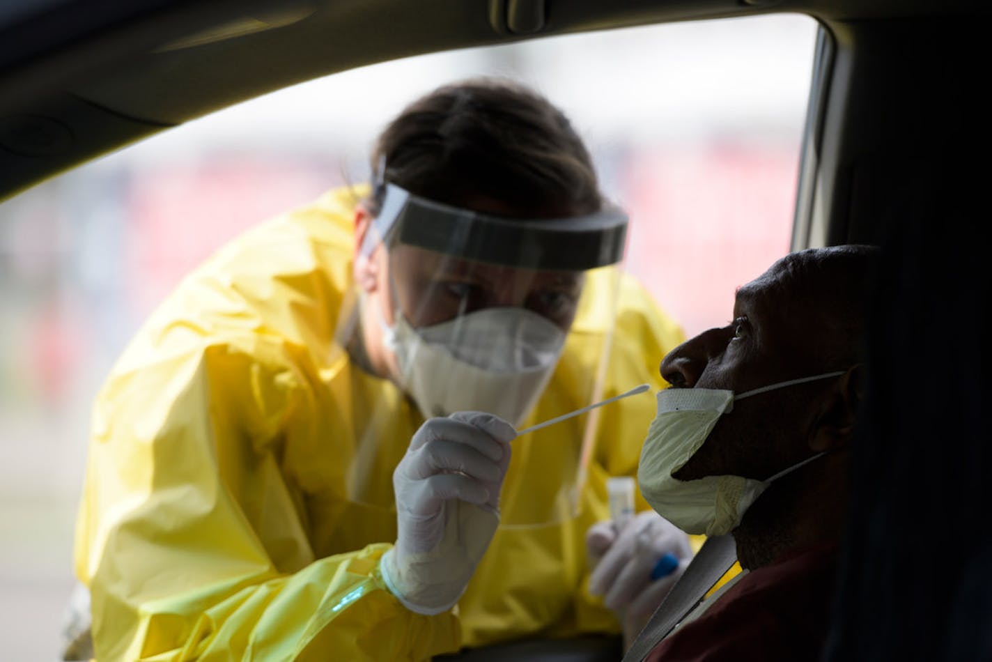 Kristin Anderson, a medic with the Minnesota Air National Guard's 133rd Medical Group, administered a free COVID-19 test to Jimmie Turner, 65, of Stillwater, in late May.