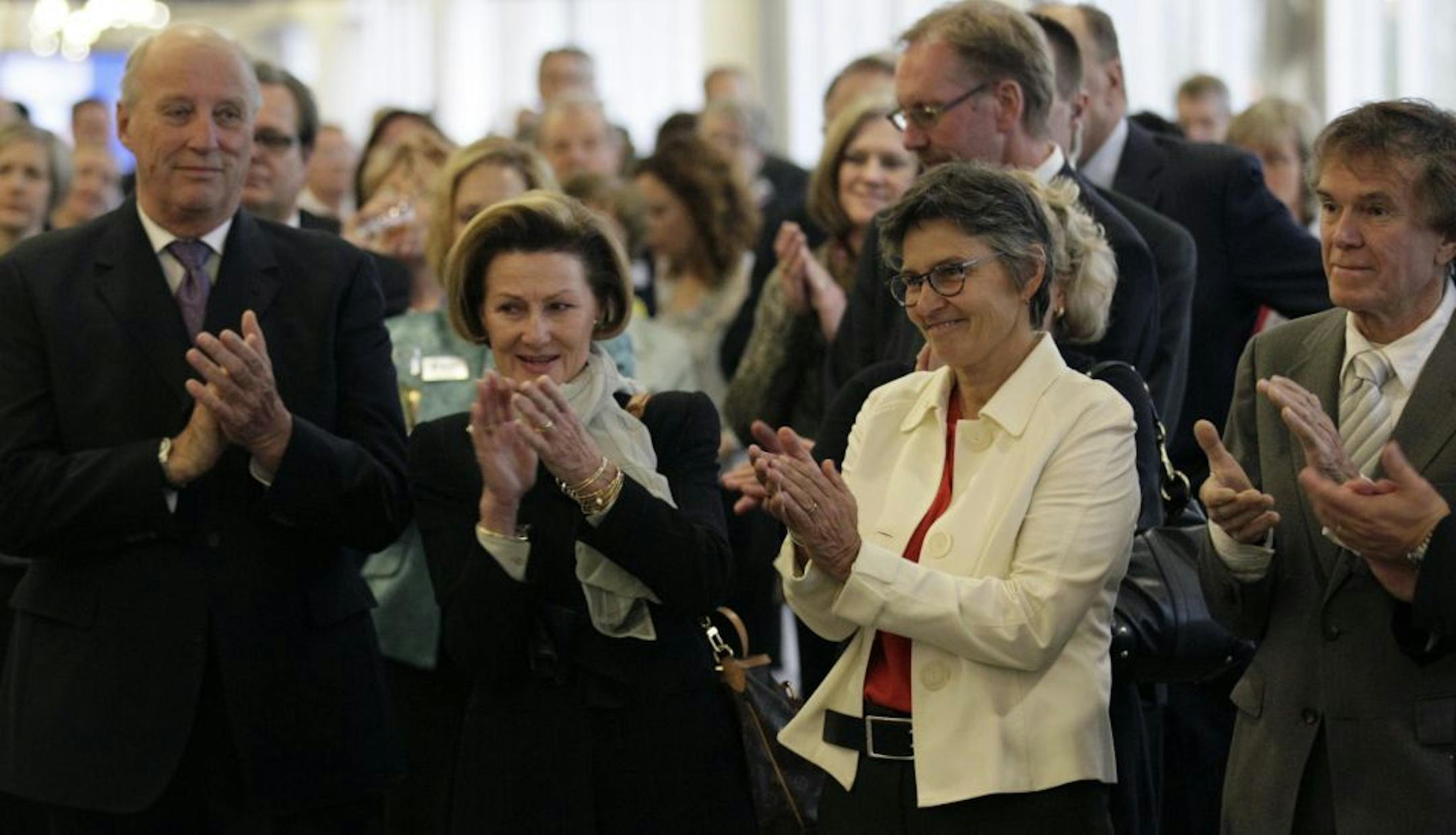 Ann Bancroft, second from right, applauded along with Will Steger, right, and King Harald and Queen Sonja of Norway as they listened to Norwegian explorer Liv Arnesen dedicate an exhibit celebrating the 100 year anniversary of the Roald Amundsen South Pole Expedition. The event was at the Minneapolis-St. Paul International Airport.