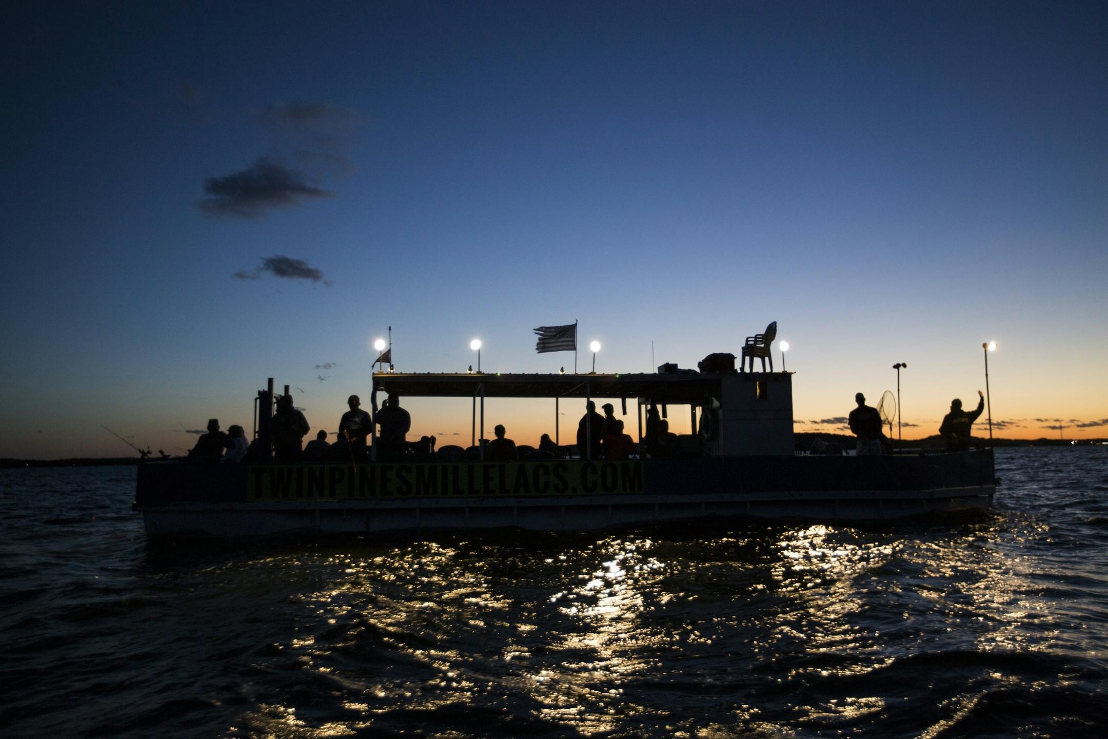 Customers on an evening fishing expedition with Twin Pines Resort catch the sunset on Mille Lacs Lake Monday, August 3, 2015.