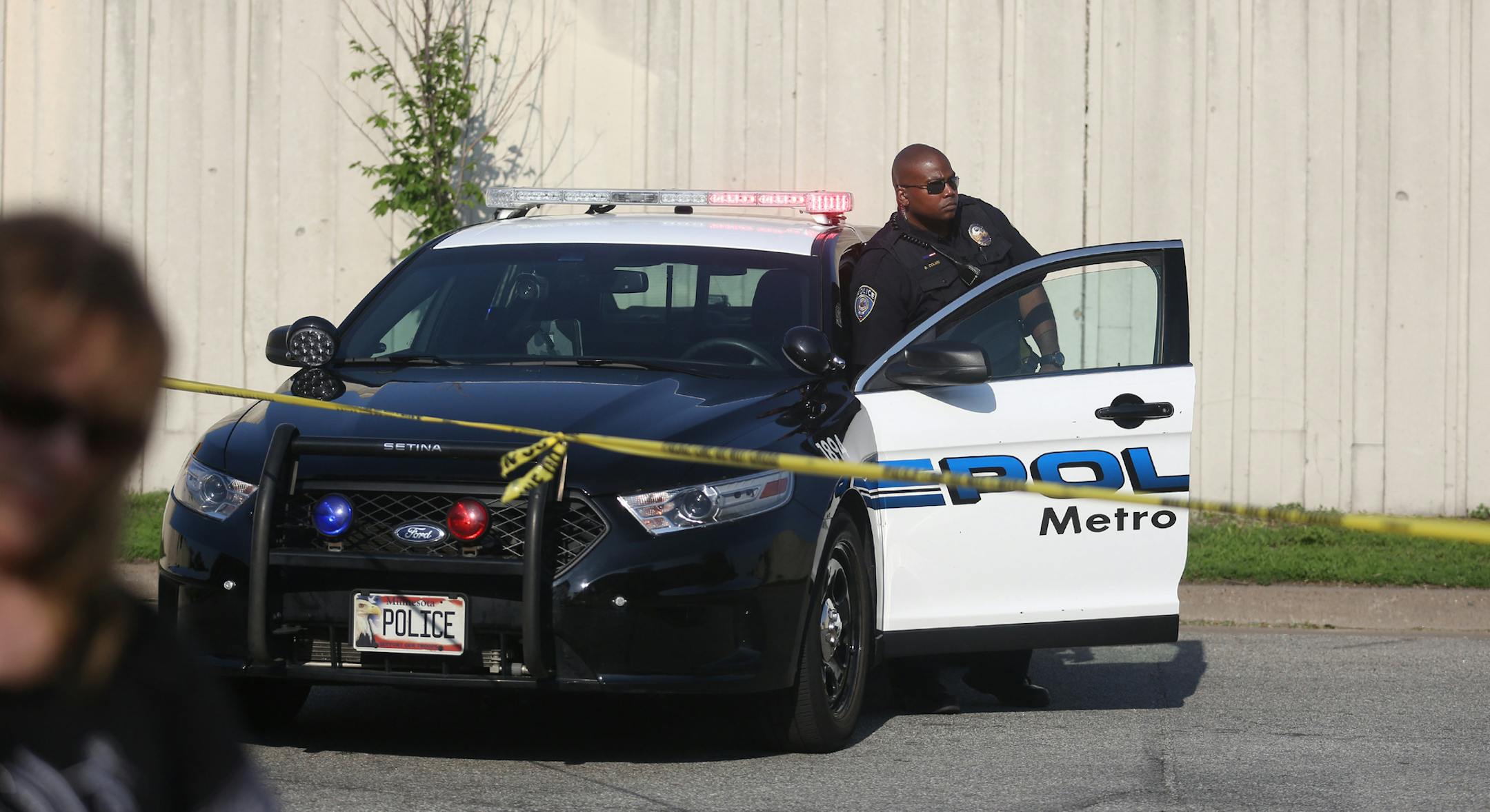 Police and tape blocked off the street near the corner of 25rd Ave. and 3rd St. N after a foot chase that left one suspect shot another injured and an officer injured. ] (KYNDELL HARKNESS/STAR TRIBUNE) kyndell.harkness@startribune.com Shooting in North Minneapolis, Min. Friday, May 30, 2014.