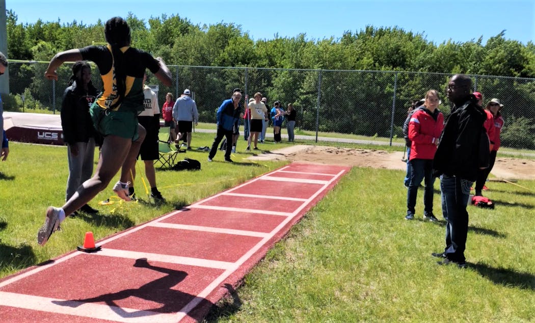 Park Center junior LauBenra Ben in the midst of a triple jump during a recent track meet.