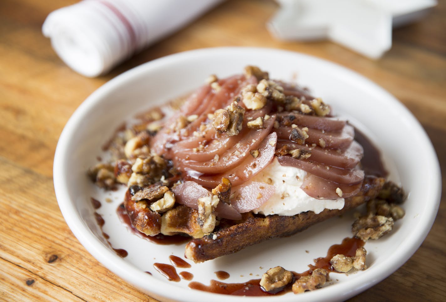 A waffle with poached pears and caramelized walnuts at L'Etoile du Nord in Bayport, Minn. on Friday, March 6, 2015. ] LEILA NAVIDI leila.navidi@startribune.com /