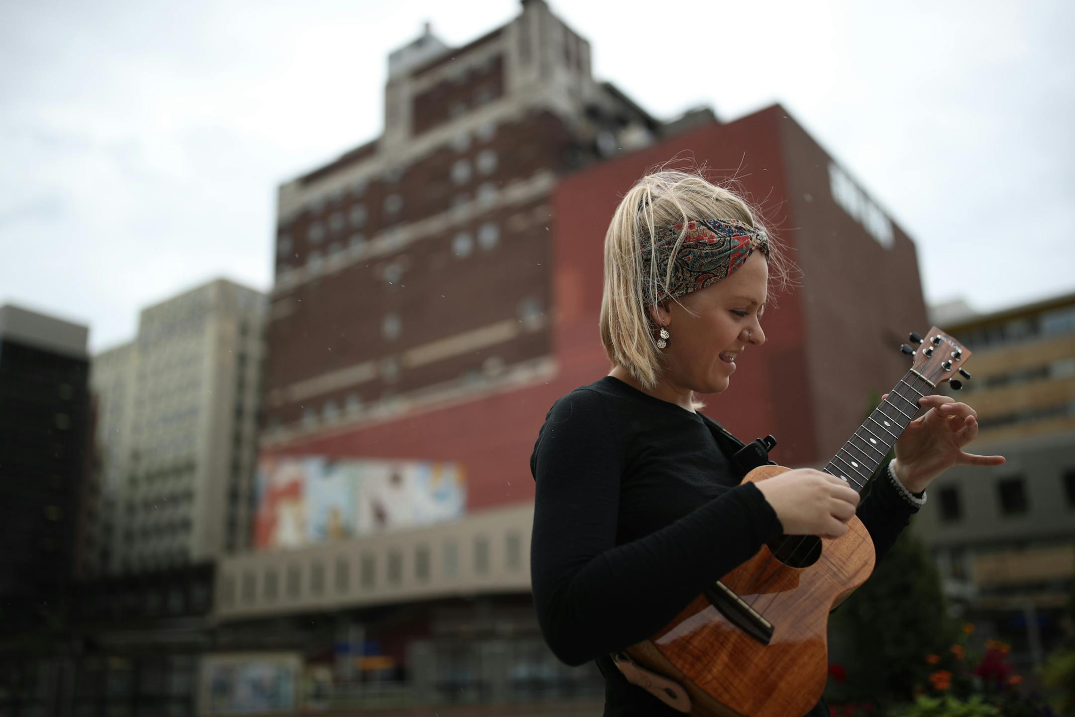 Ukulele instrumentalist Marlowe Teichman played at Central Station block during the lunch hour Wednesday August 9, 2017 in St. Paul, MN. ] JERRY HOLT ï jerry.holt@startribune.com