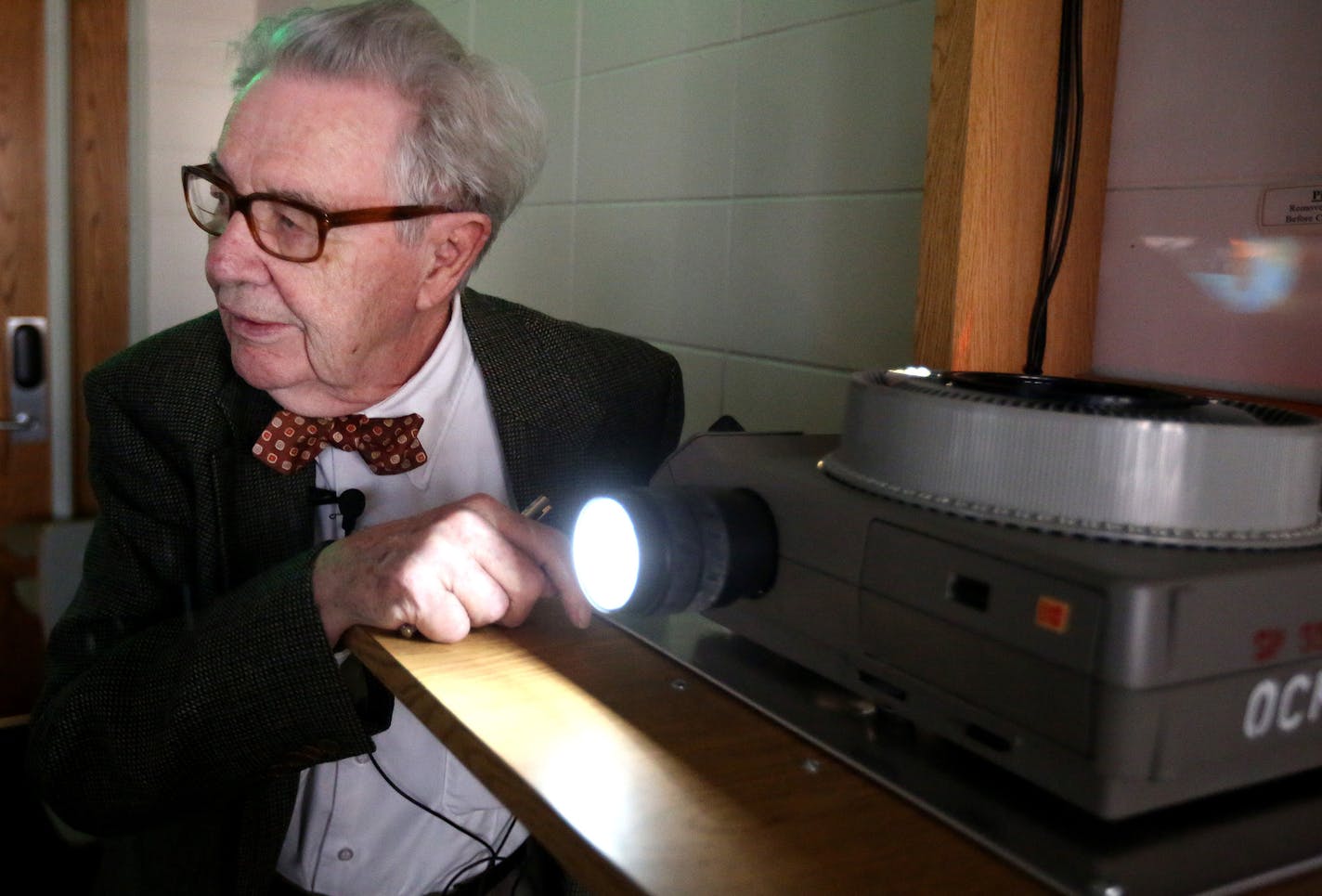 Professor John Fraser Hart projected images on the wall from a slide projector at the University of Minnesota Wednesday April 29, 2015 in Minneapolis, MN. Professor John Fraser Hart 91, a Social Sciences teacher is the oldest professor that the University of Minnesota has and he has decided to retire.] Jerry Holt/ Jerry.Holt@Startribune.com