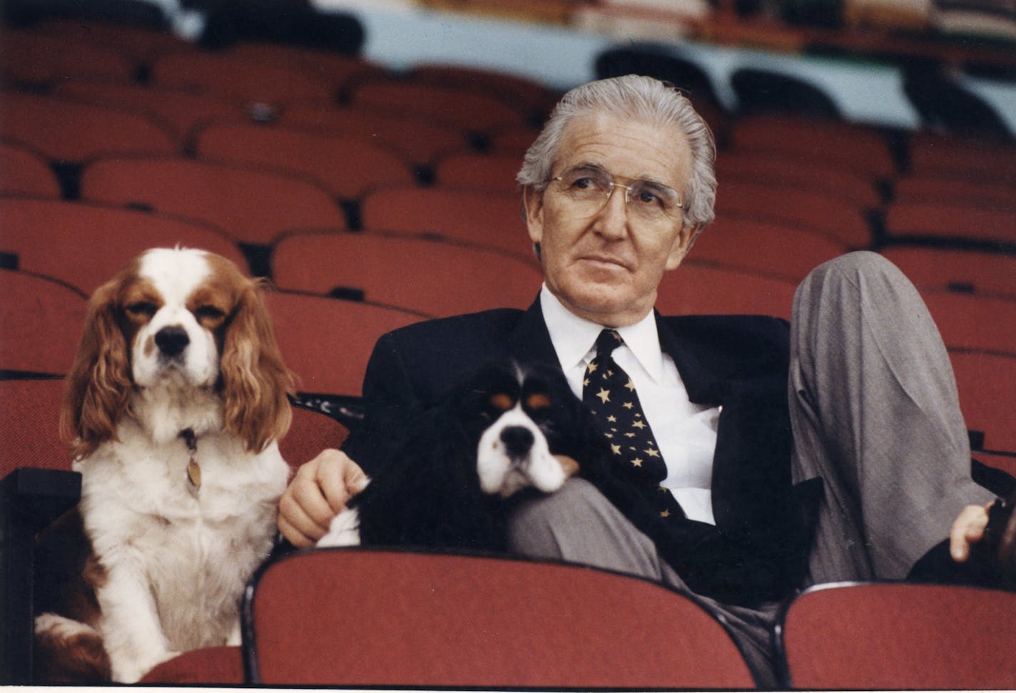 Norm Green, former owner of the North Stars, shown in a 1991 photo with his dogs, Charles and Rupert.