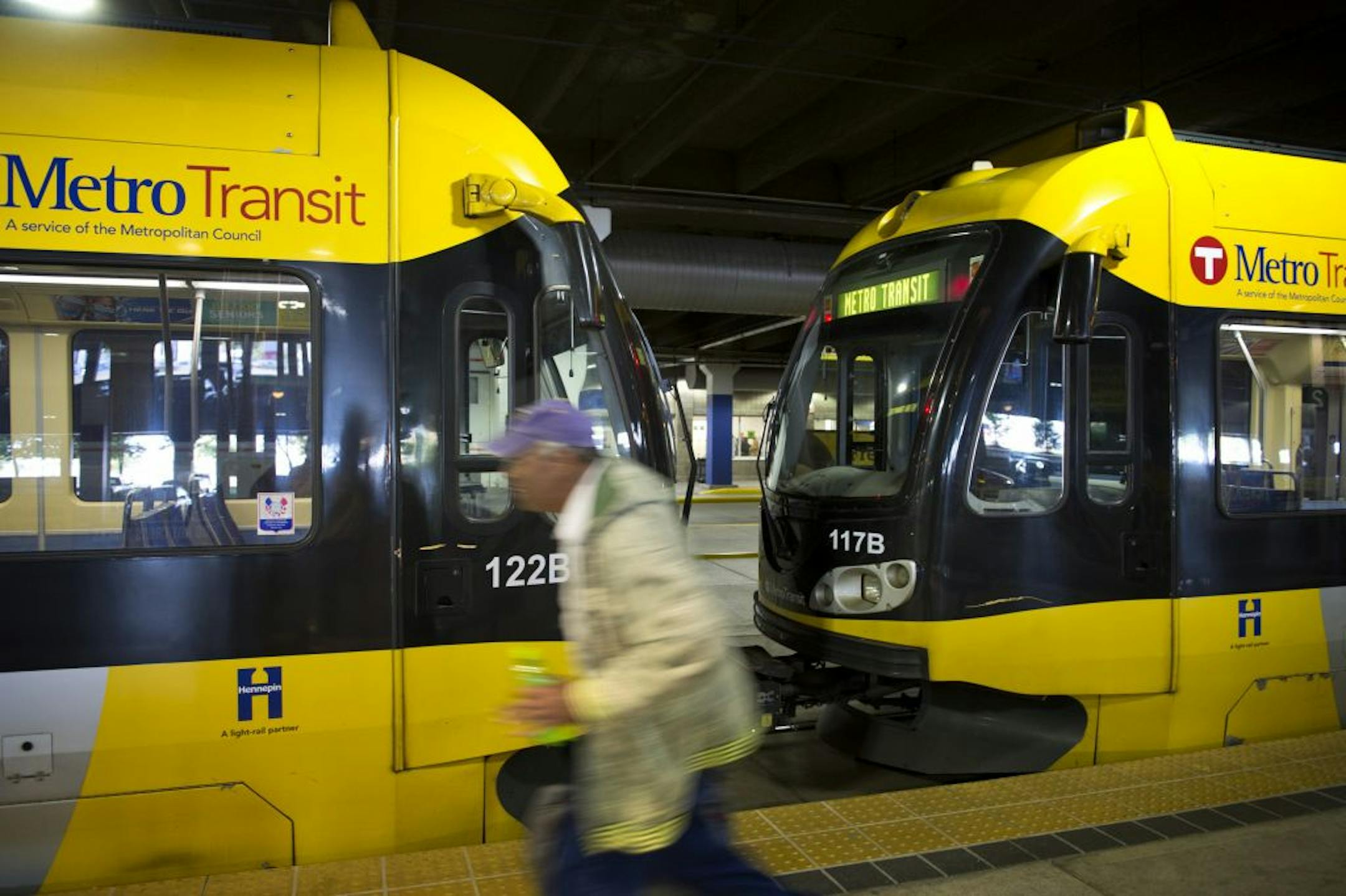 Passengers head to Metro Transit light rail trains at the Mall of America station in Bloomington, Friday, September 21, 2012
