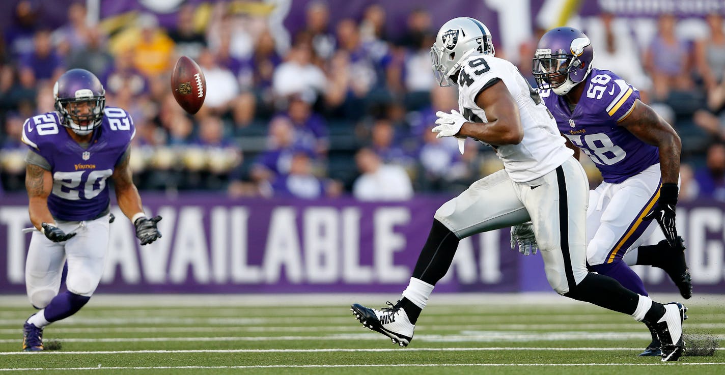 Minnesota Vikings Kurt Coleman (20) intercepted a Derek Carr pass intended for Jamize Olawale (49) in the second quarter.